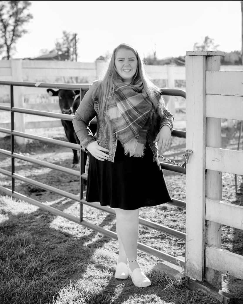 Black and white photos of someone near a wooden railing outdoors, shown as a sequence of three connected images.