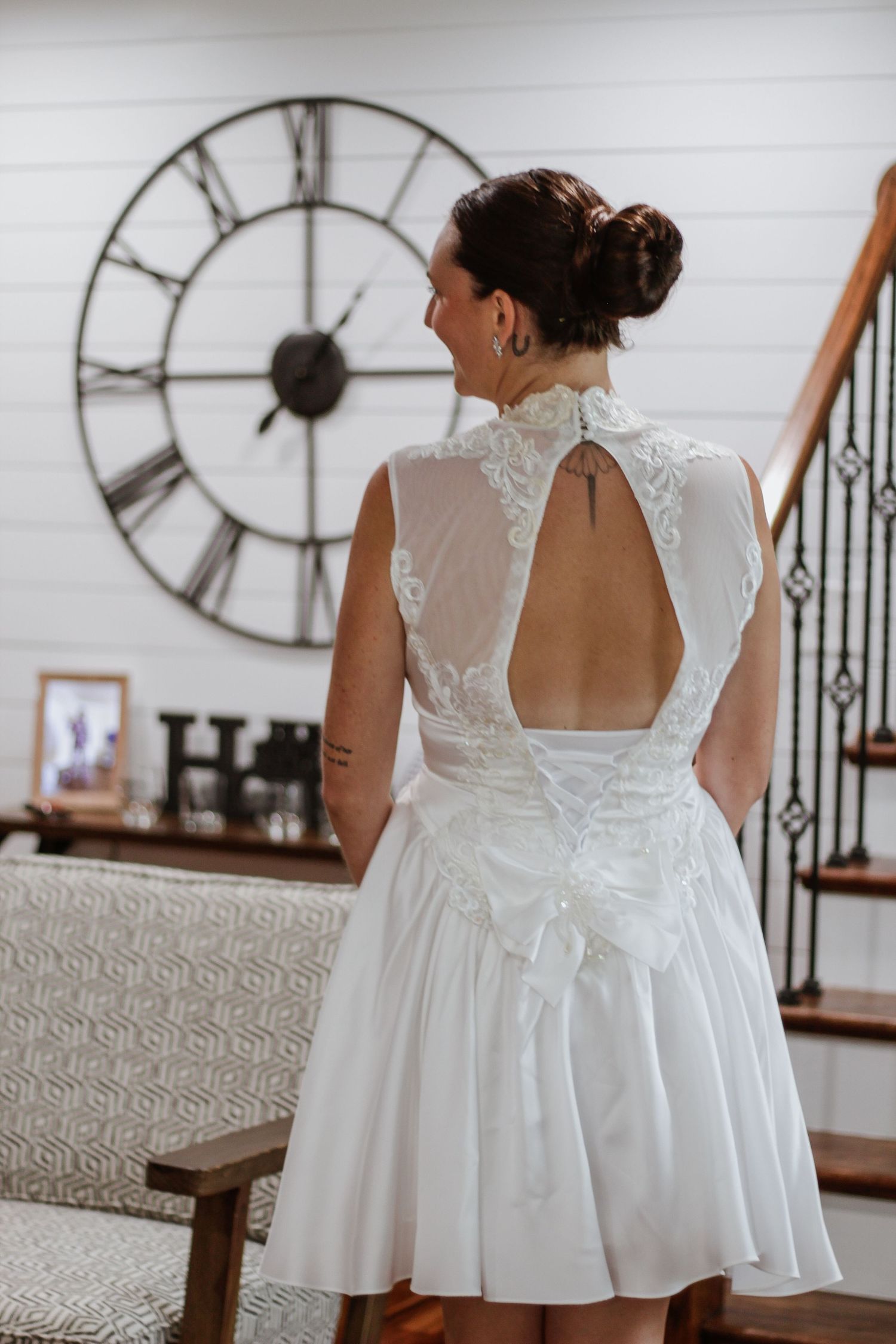 Detail shots of white lace wedding dresses with open backs and delicate details.