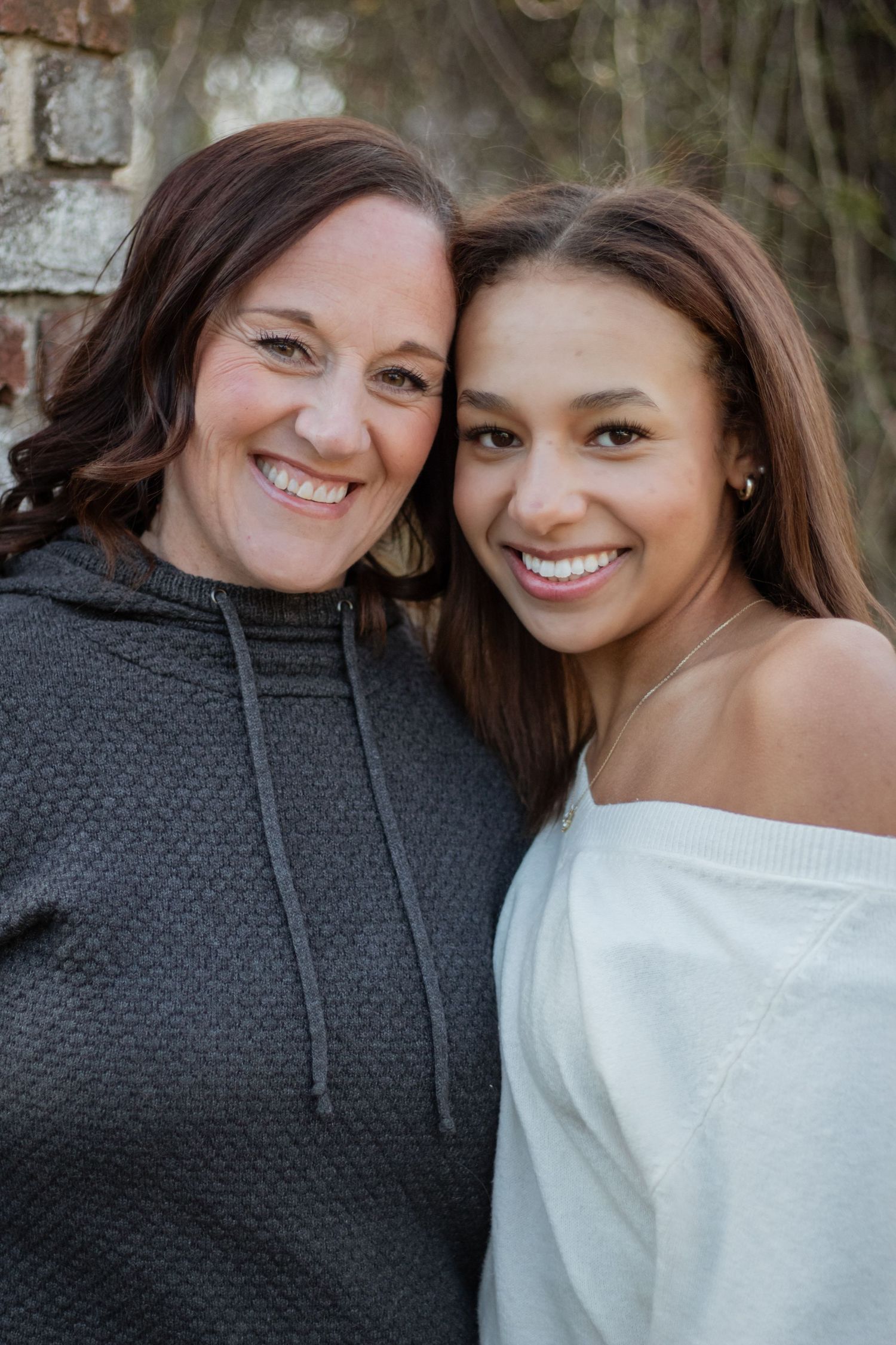 Two friends sharing joyful laughter together in a series of casual outdoor portrait photographs.
