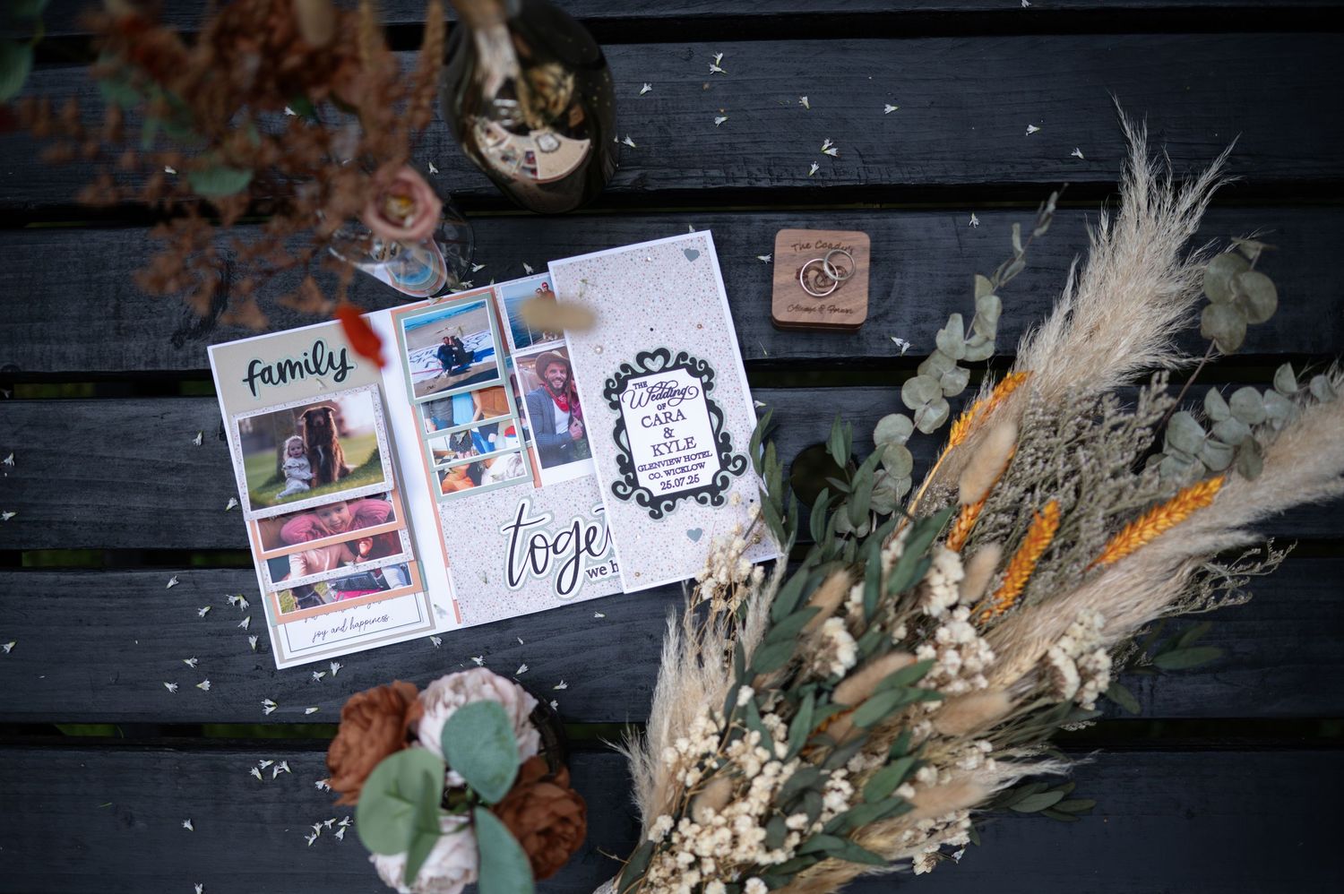 Flat lay image of details of wedding day, flowers and wedding card