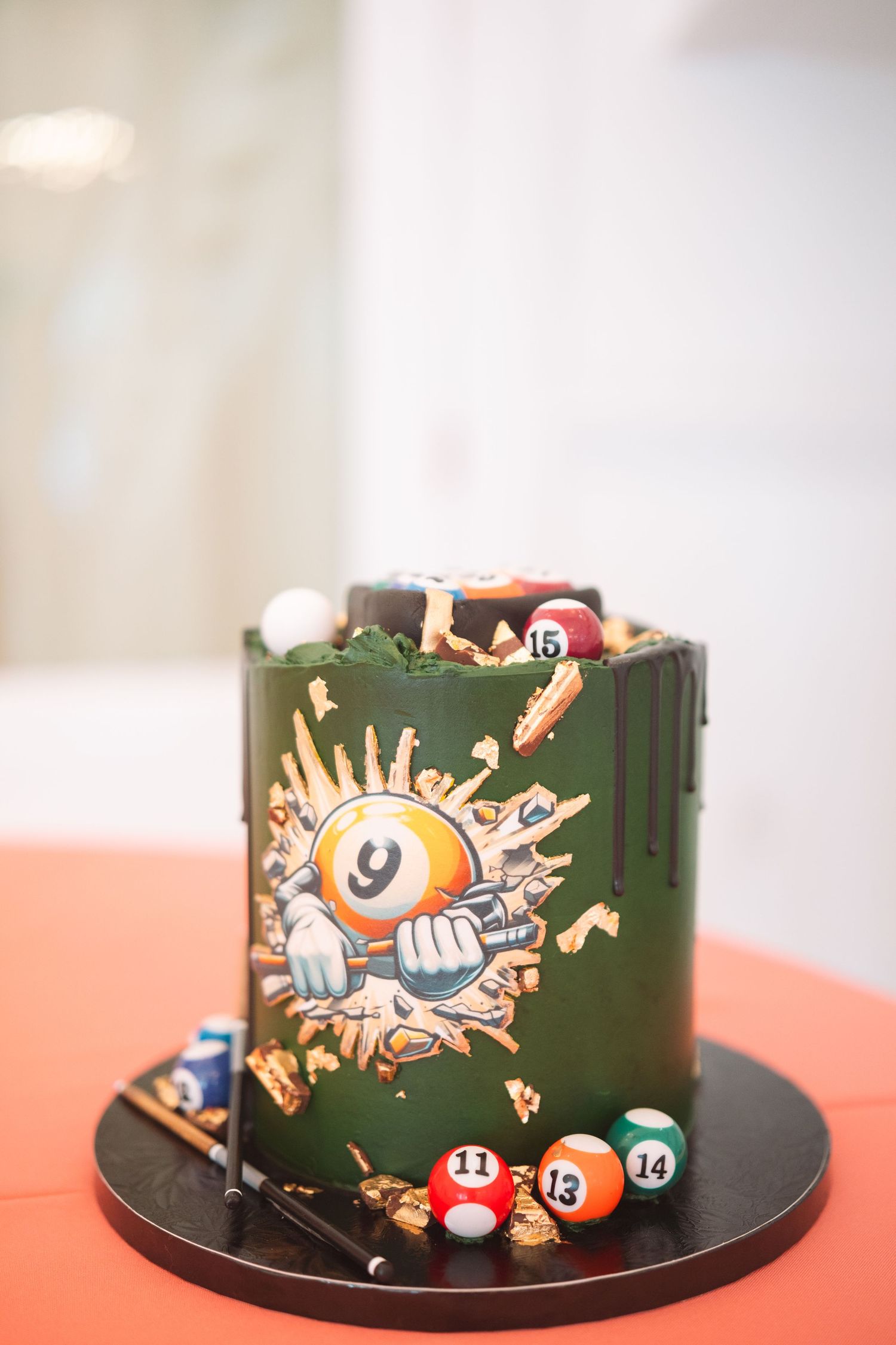 Dark green billiard-themed wedding groom cake decorated with pool balls and a 9-ball illustration.