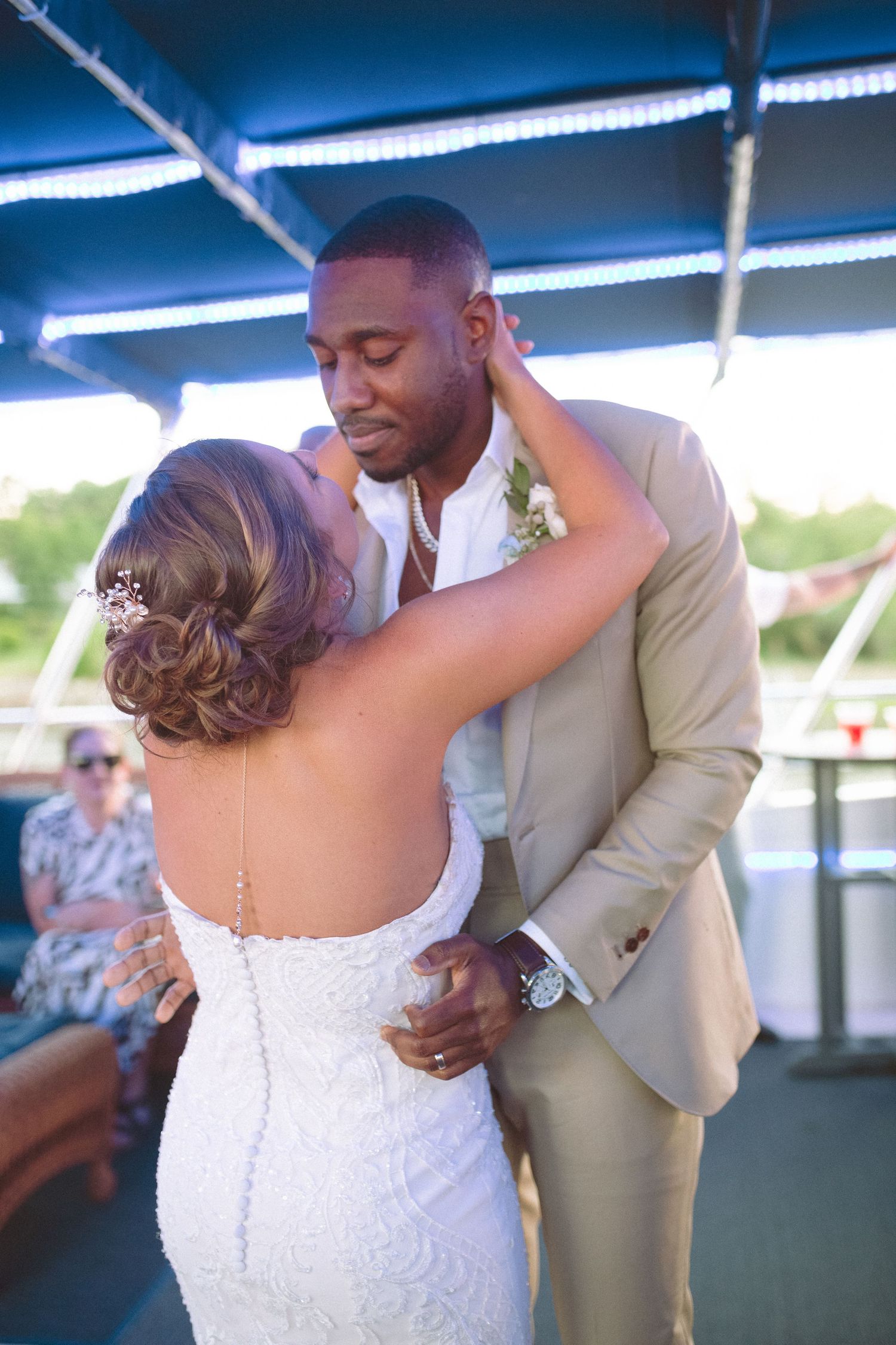 Bride and groom share an intimate first dance moment on a boat wedding reception.