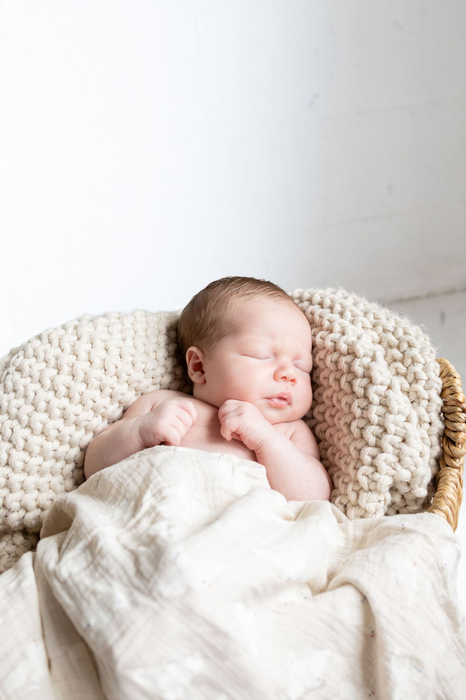 Newborn laying in basket