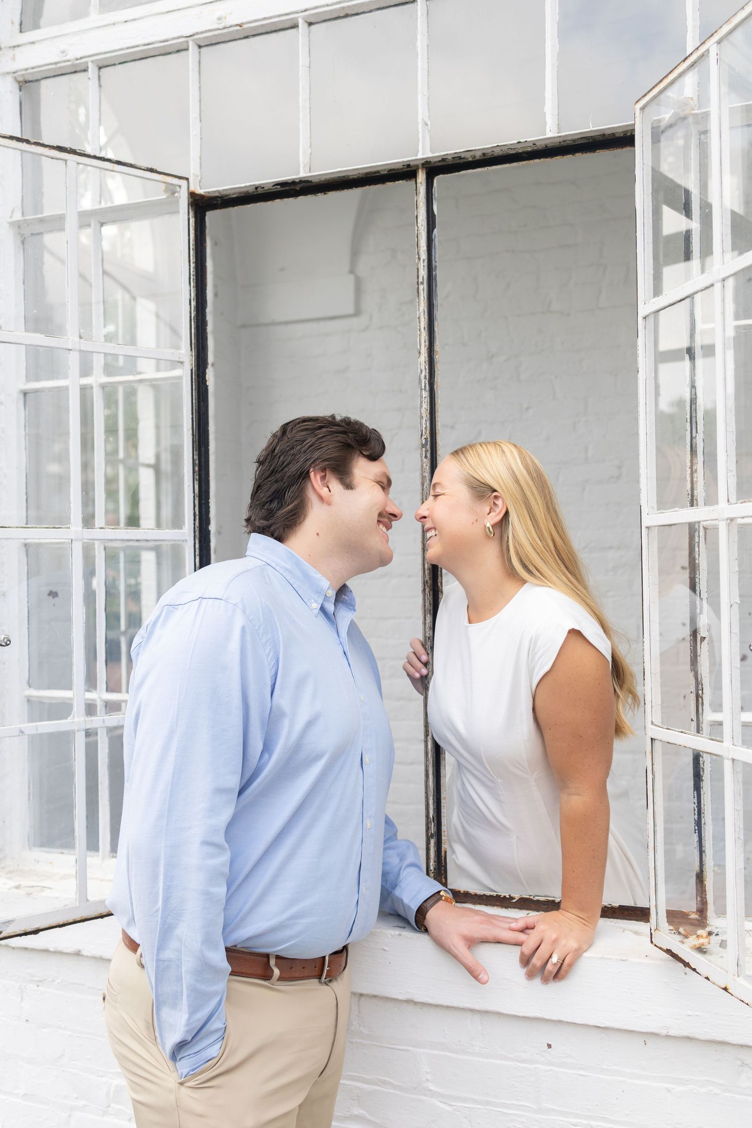 Couple looking at each other through window