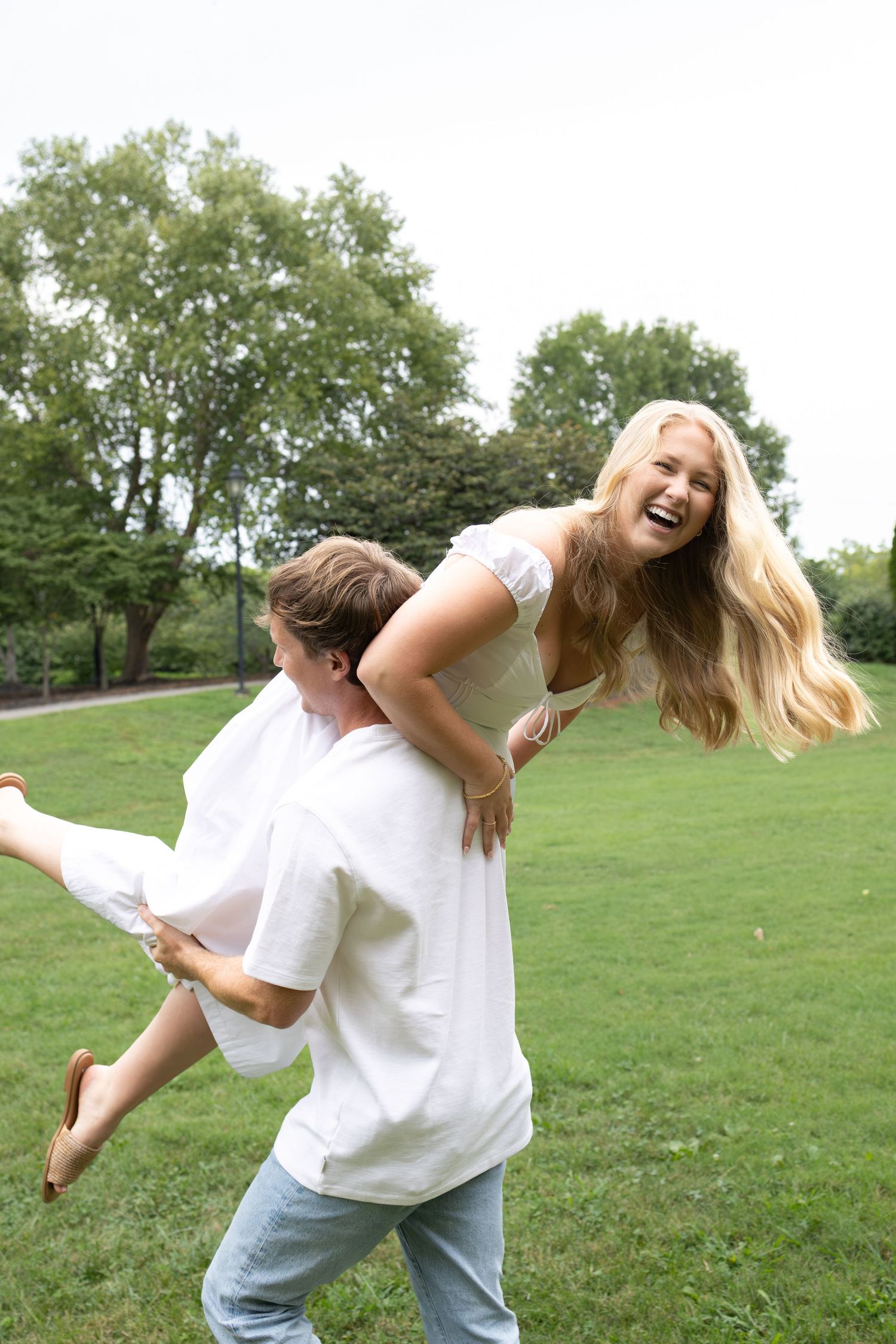 Couple playing around outside