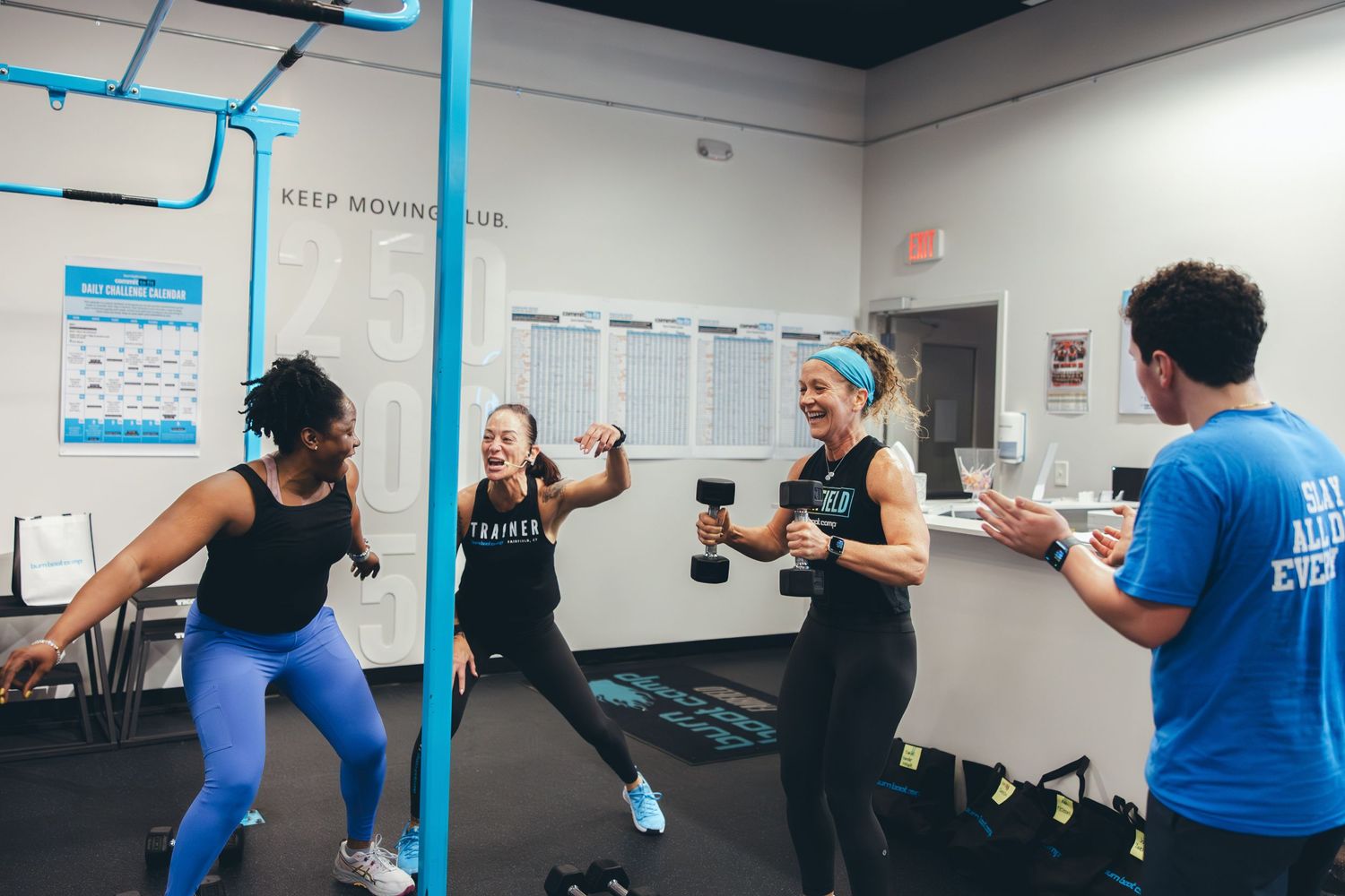 Group working out together in an energetic fitness class at Keep Moving Club.