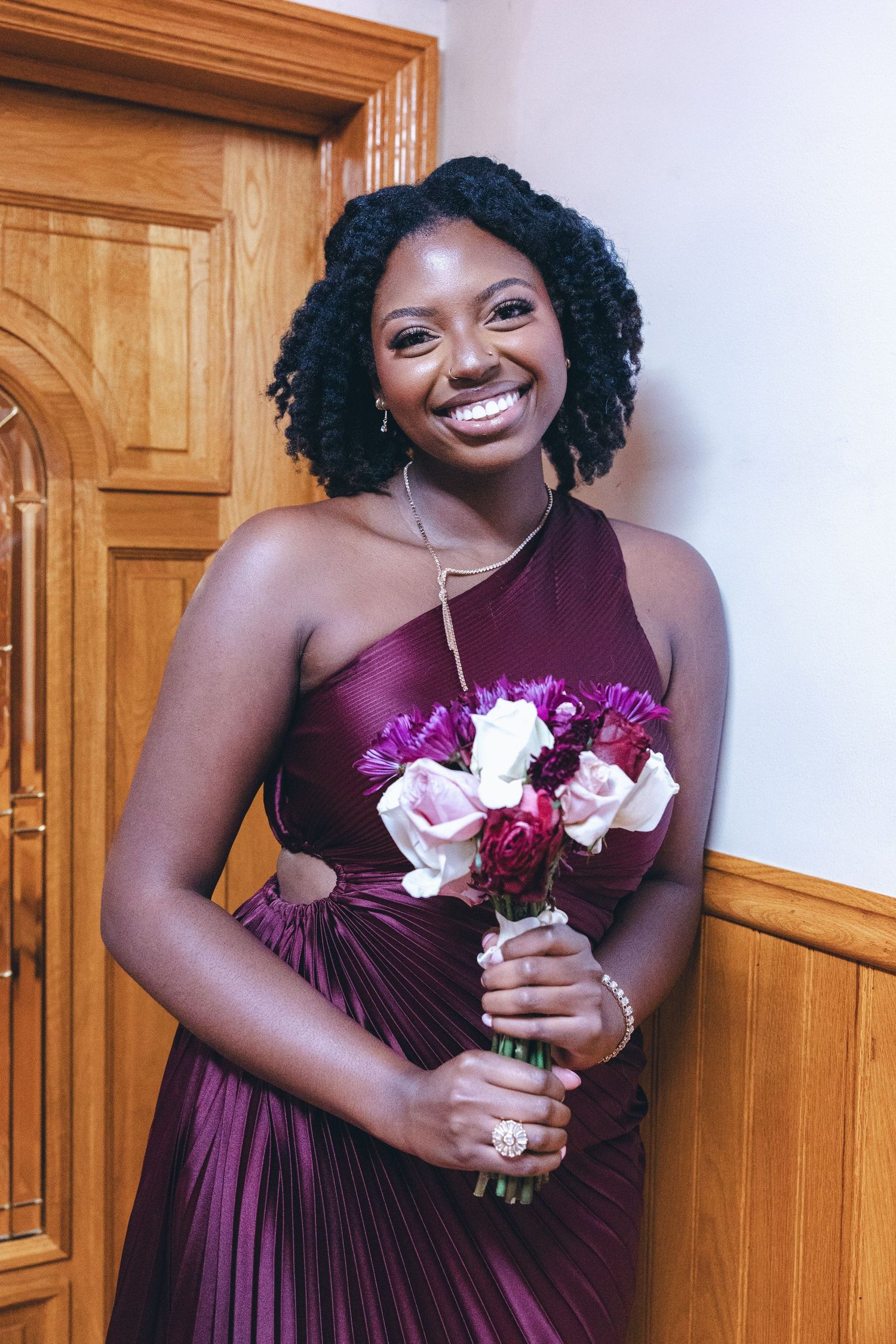 Sister of the bride smiling at the camera