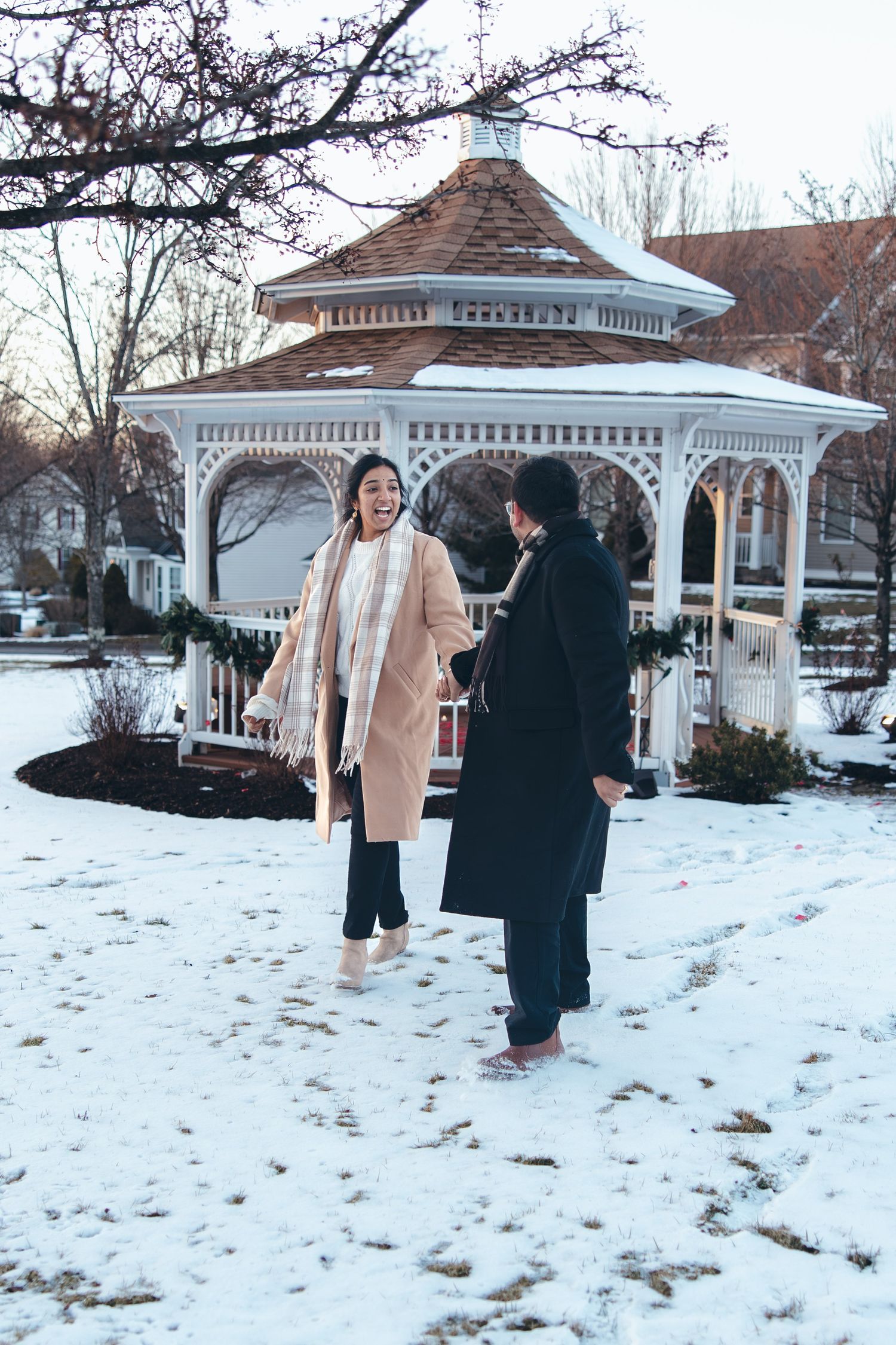 Man leading bride to be in the snow in Southbury CT after surprise engagement