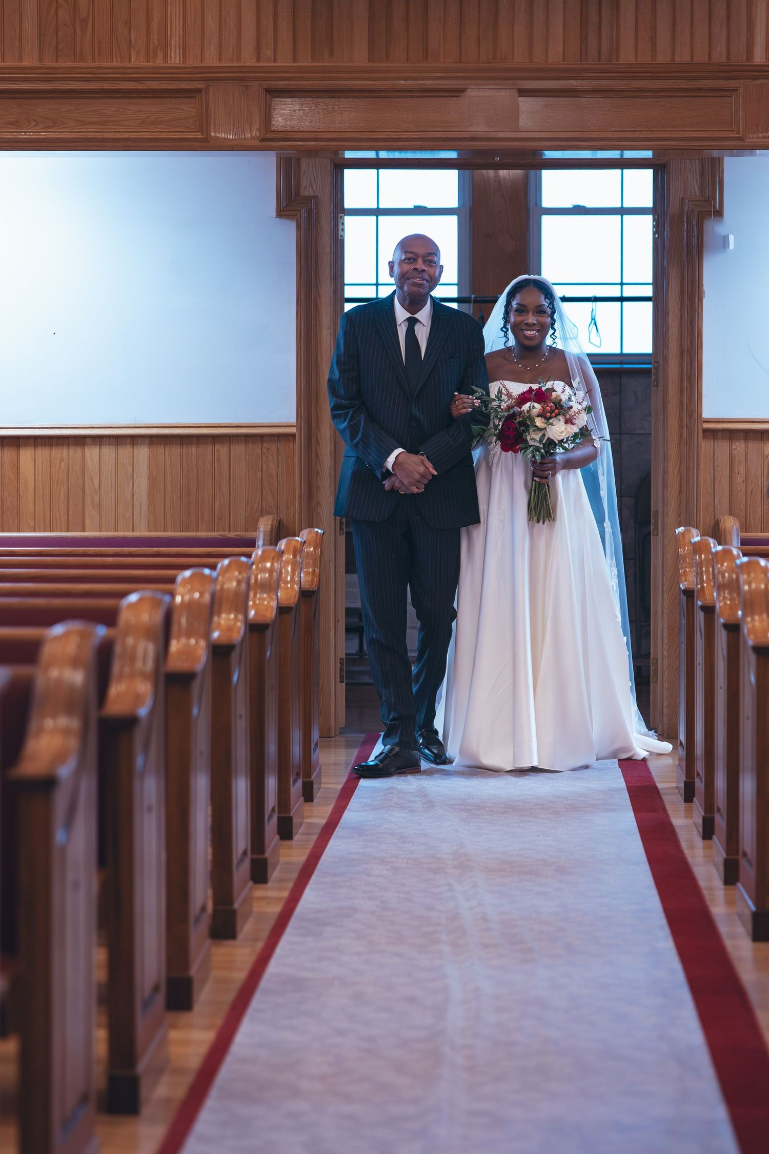 Bride and father walking down the aisle