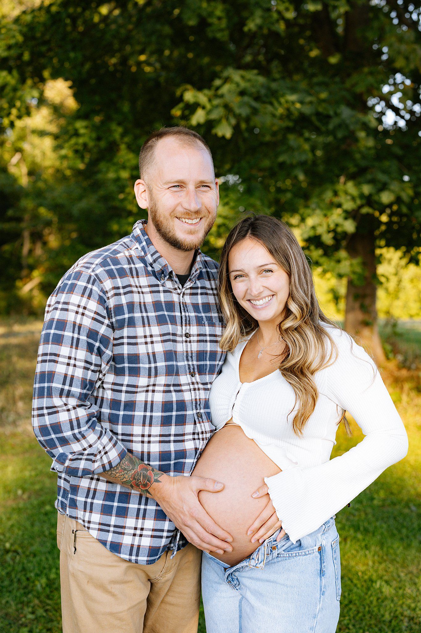 posed photo of parents to be in maternity session in connecticut