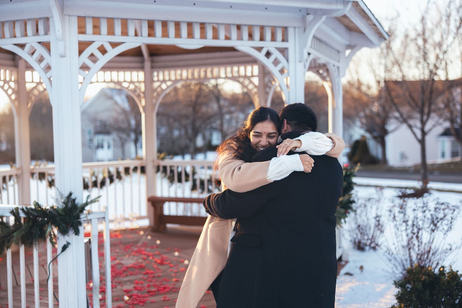 Women embracing her fiancé after surprise proposal in Southbury, CT