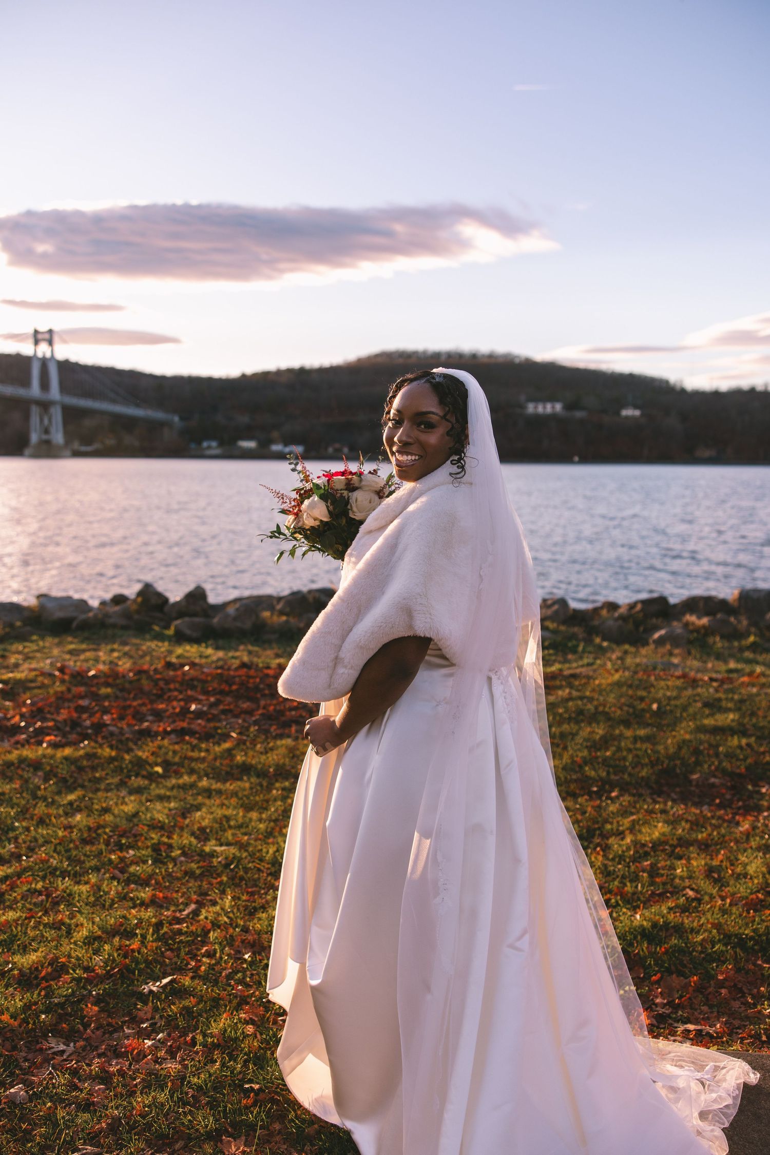bride smiling at the camera before her first look