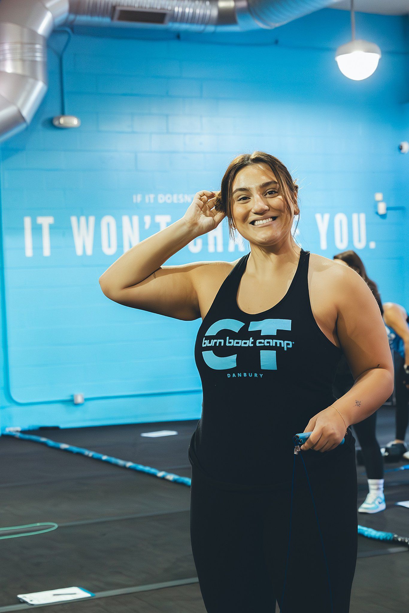 BurnBootCamp Member smiling at camera before her heat