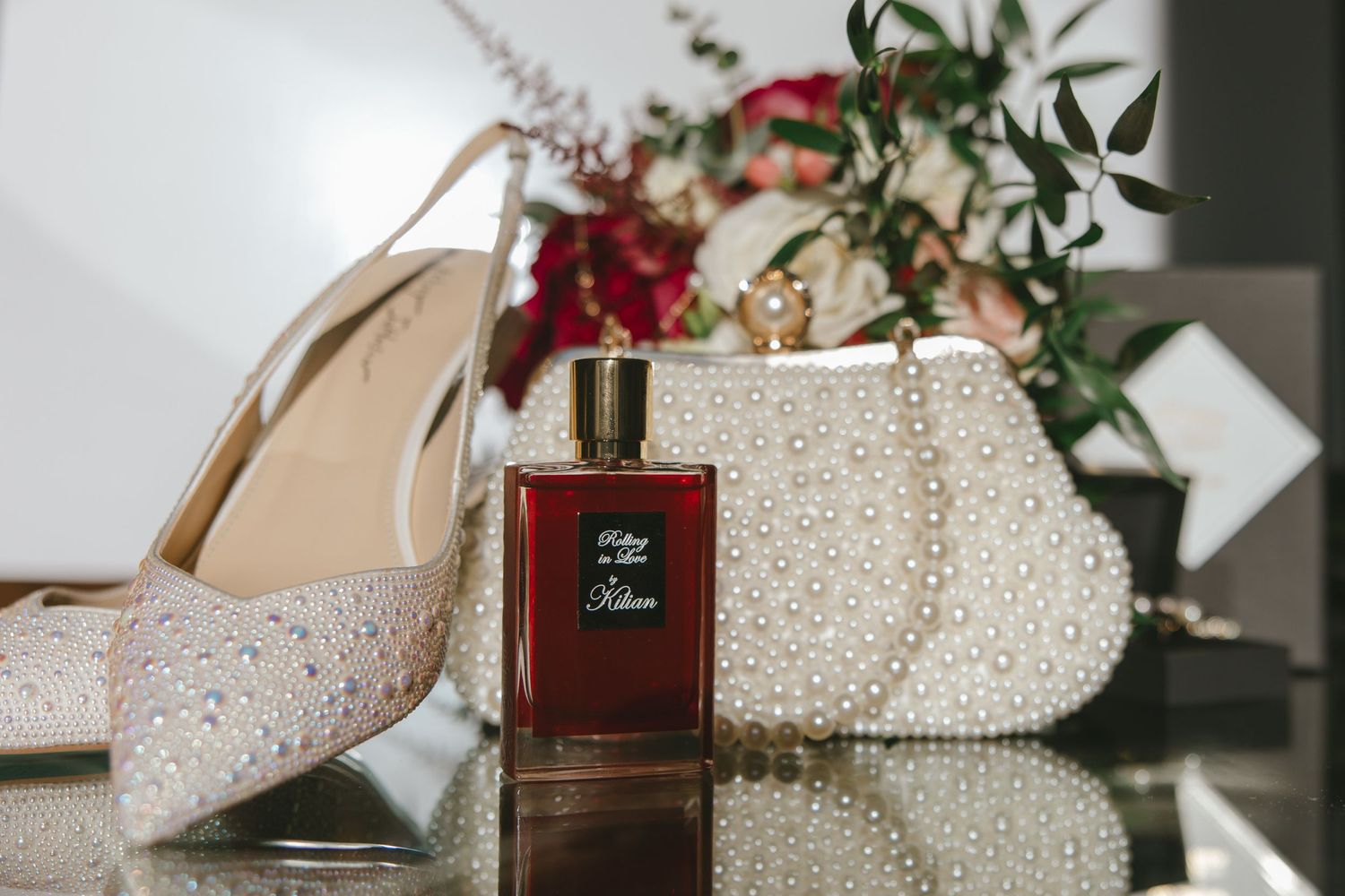 Bridal details shot with perfume, shoes and purse for her Hudson Valley wedding