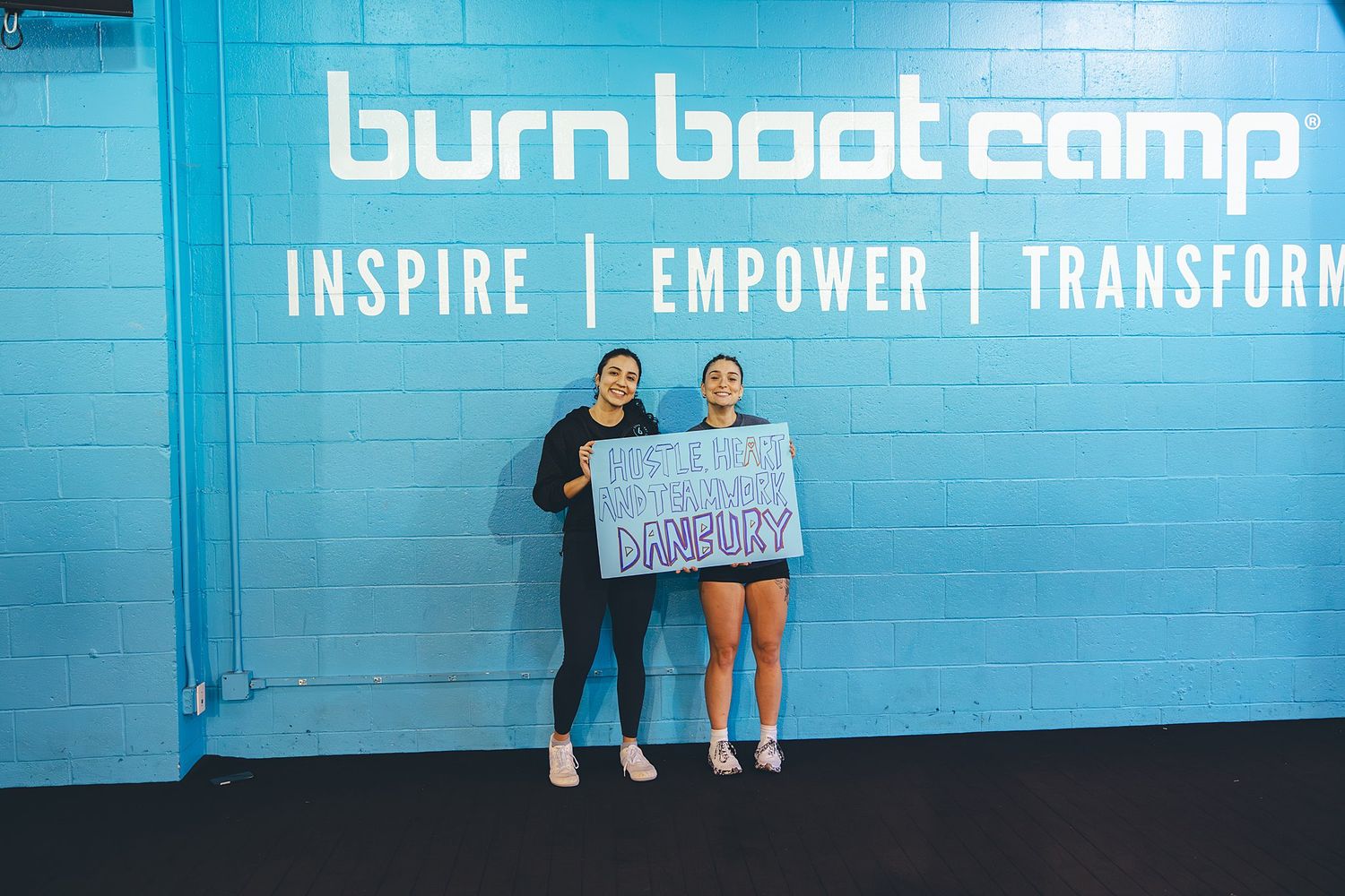 BurnBootCamp Connecticut members posing in front of sign