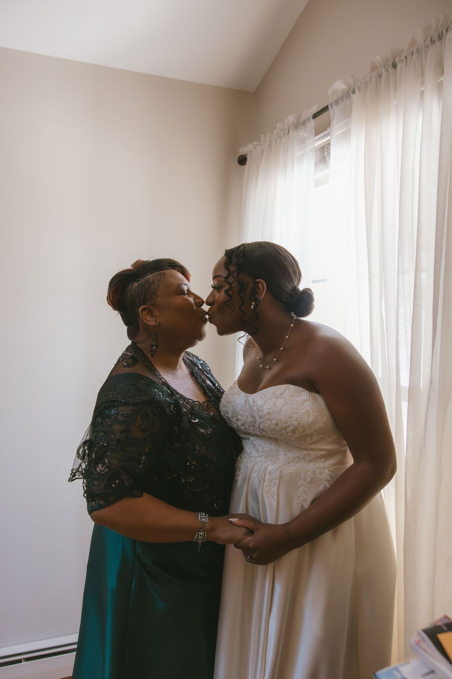 bride getting ready with her mother