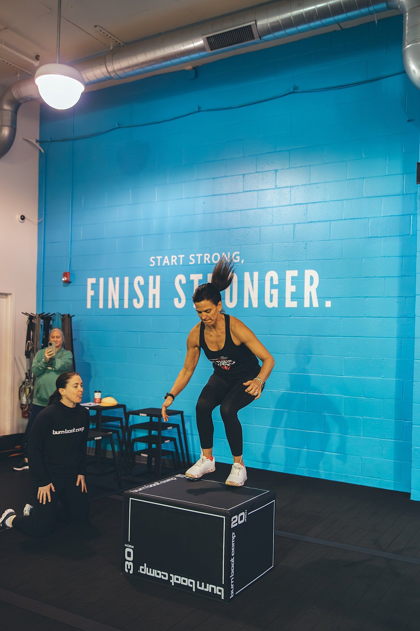 Member doing a box jump for round 2 of Hero Games