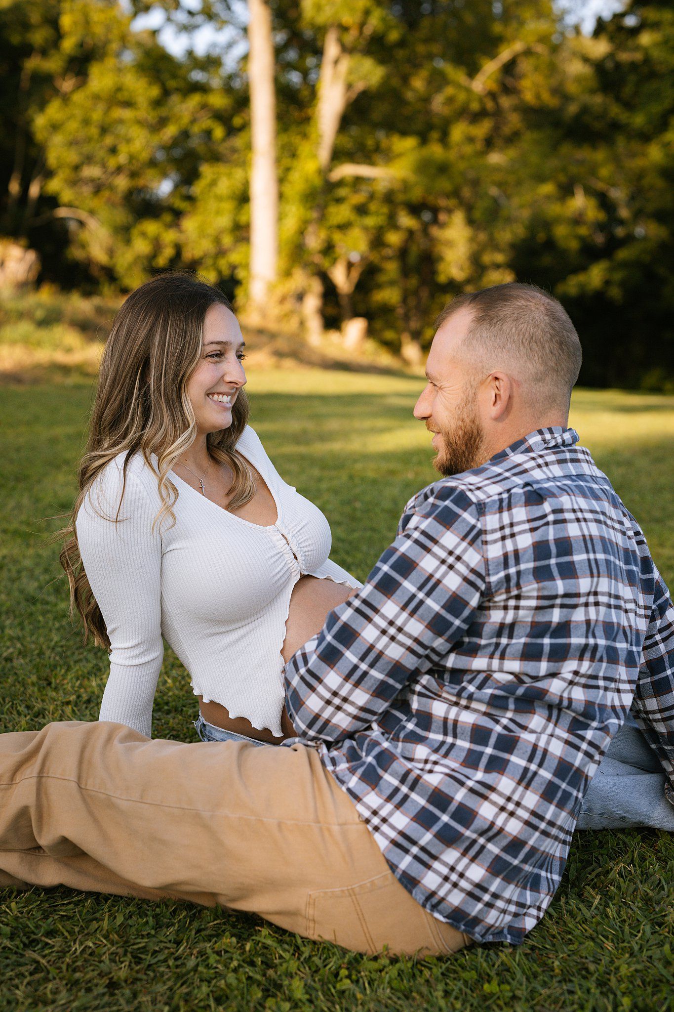 future parents to be staring at each other smiling