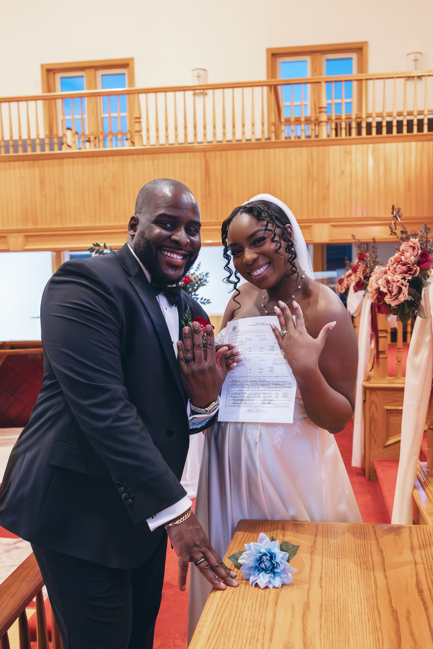 Bride and groom celebrating signing their marriage papers