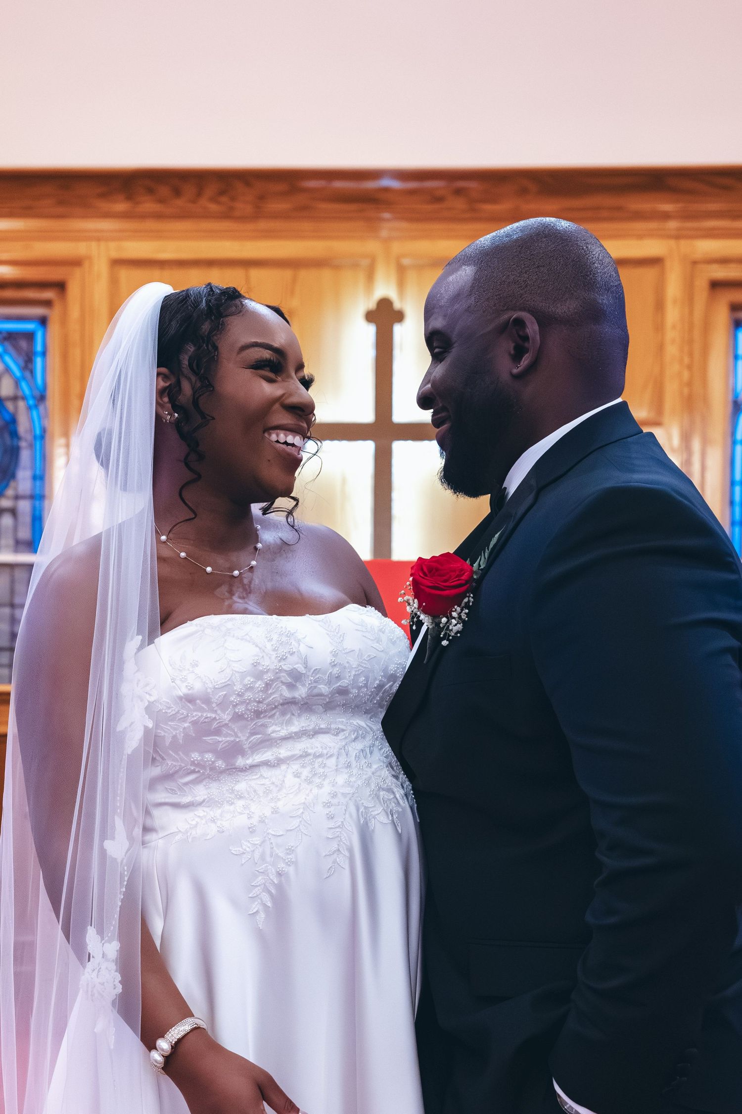 Bride and groom staring lovingly into each others eyes