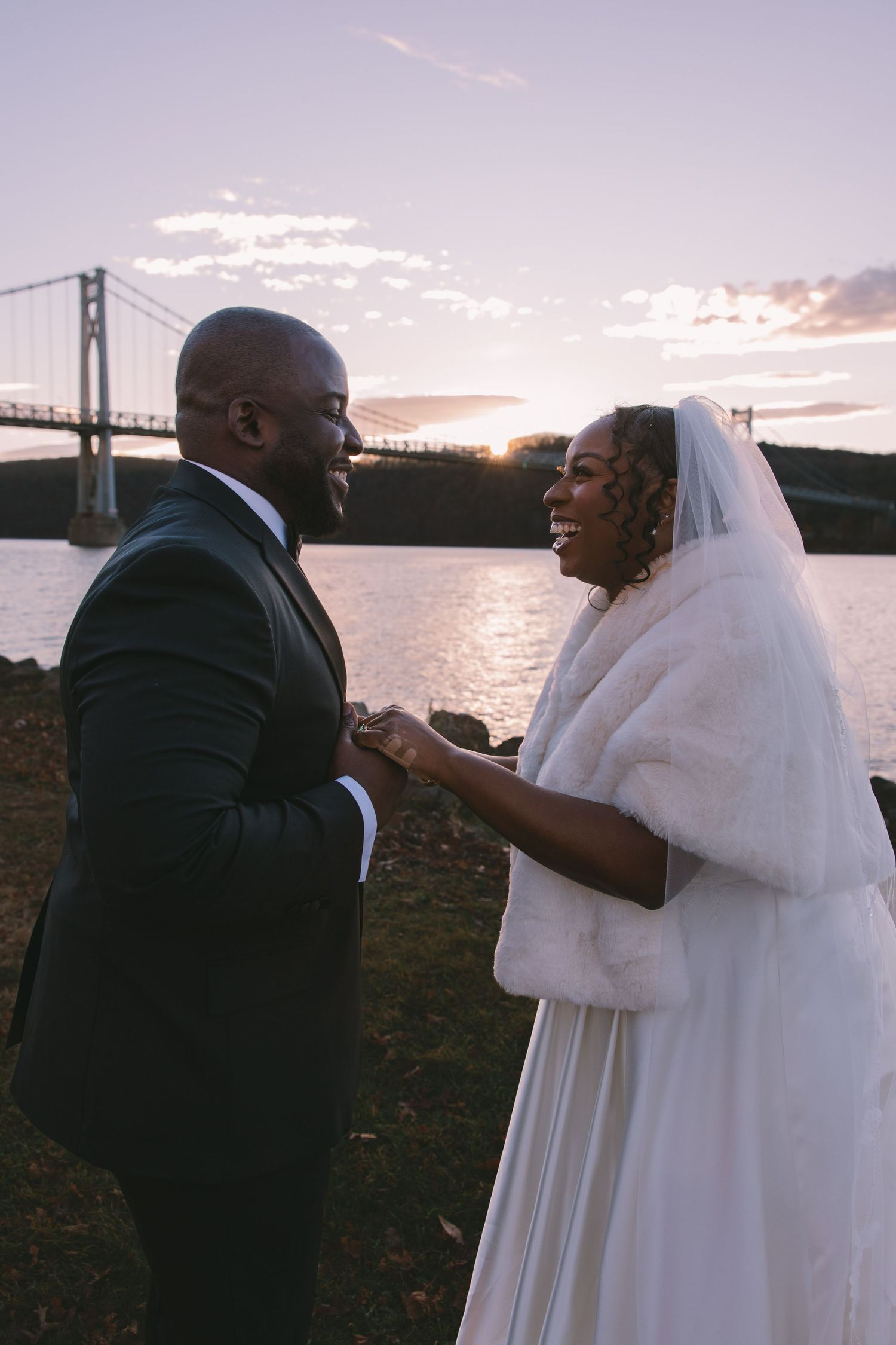 Bride and groom in front of Hudson Bridge during their beautiful golden hour first look