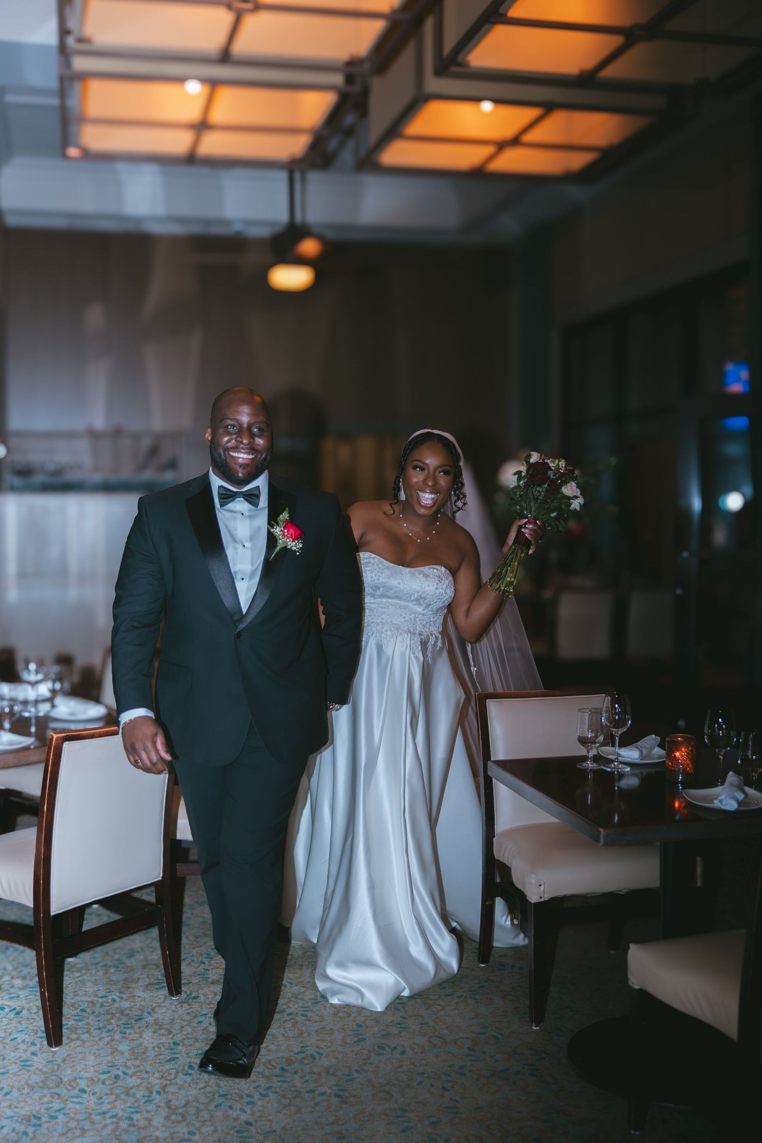 bride and groom entering the dinner reception hand in hand at Shadows on the Hudson