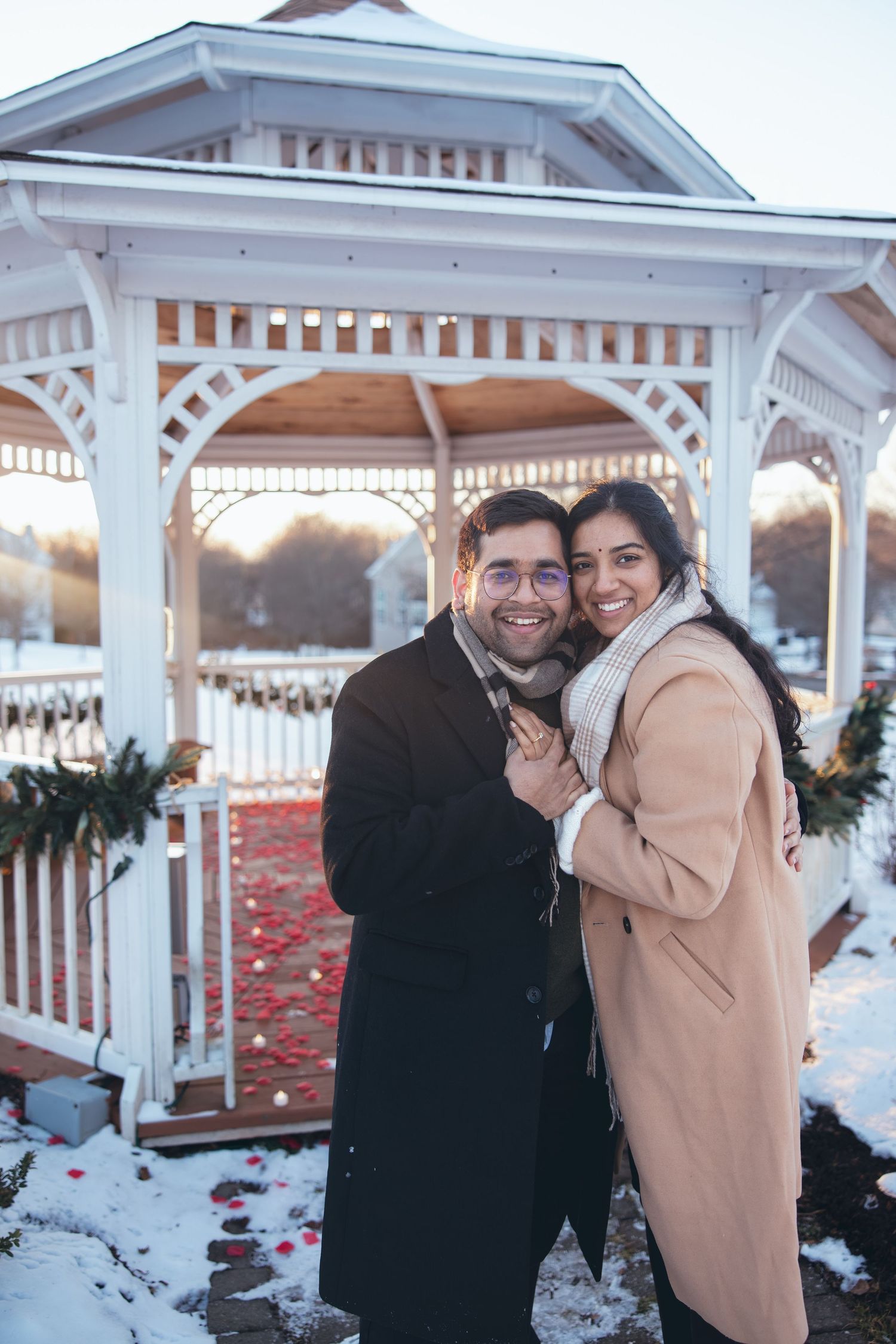Couple showing off engagement ring