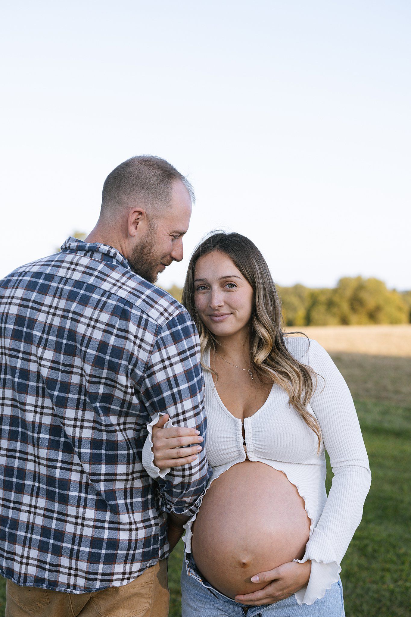 posed photo of parents to be in maternity session in connecticut