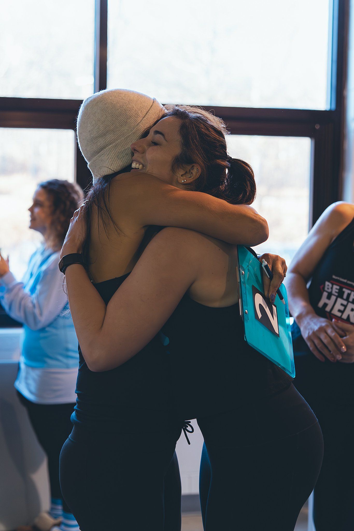 Trainer and Member hugging after member finishes the SAC