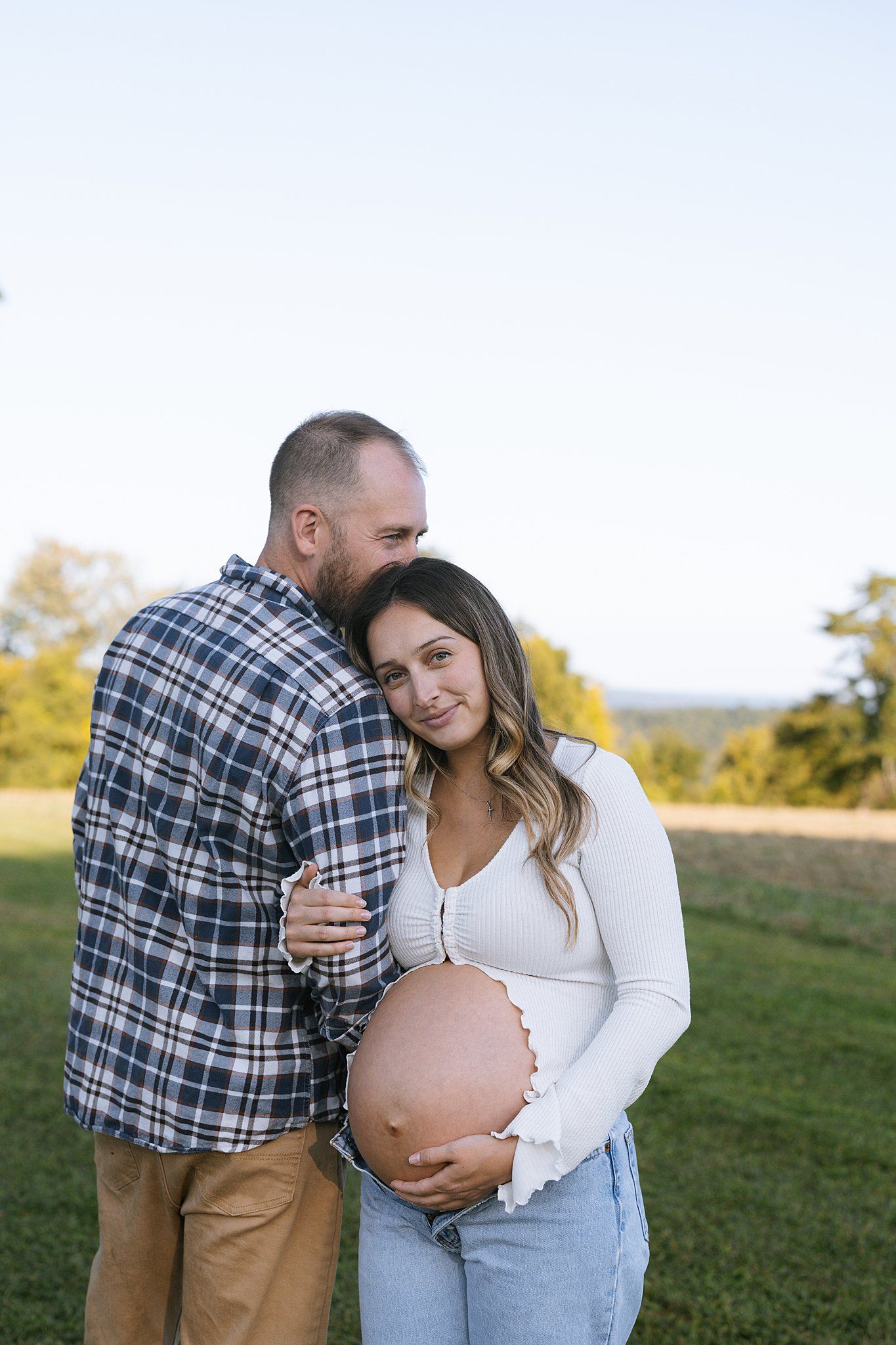 posed photo of parents to be in maternity session in connecticut