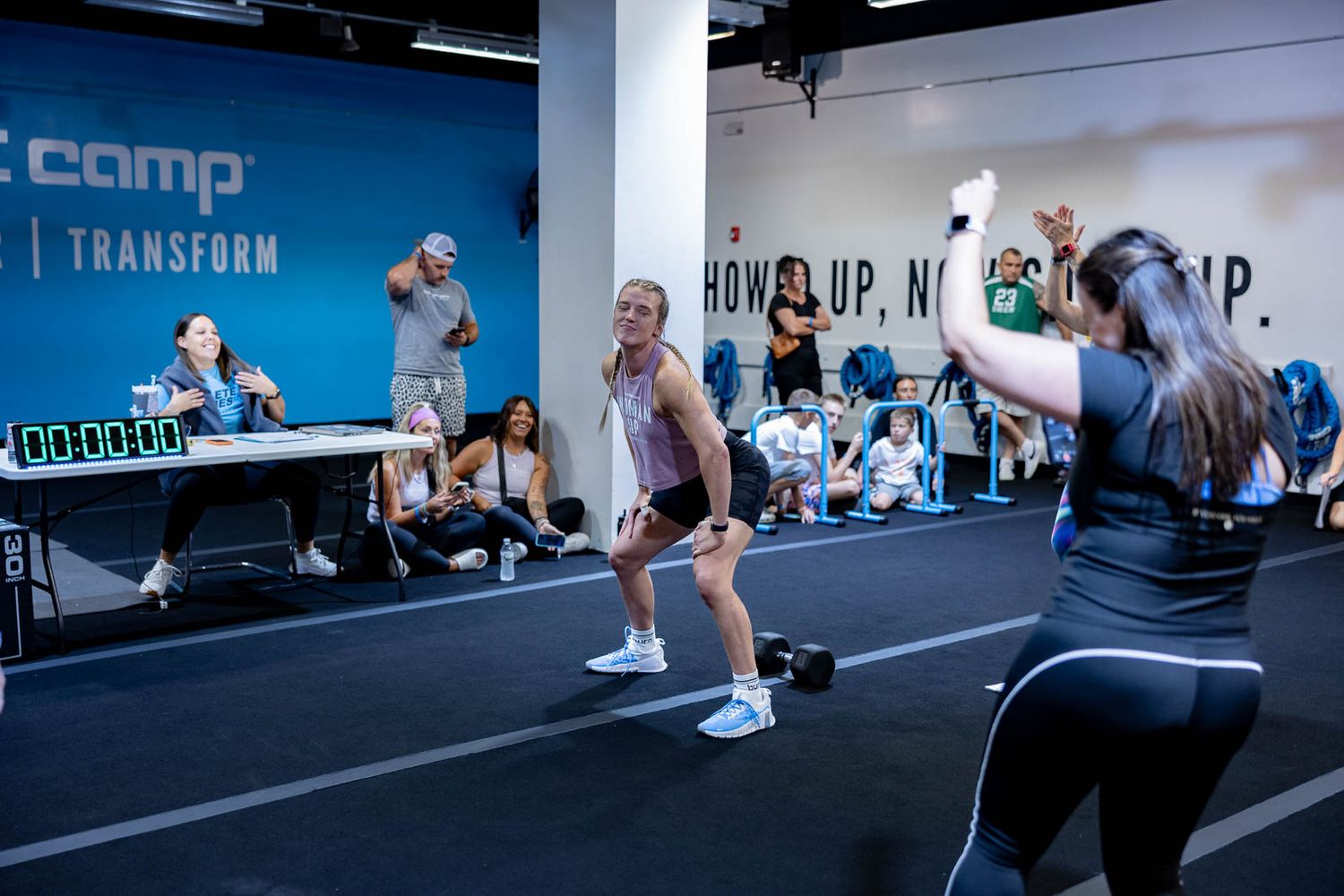 Group of people working out in a high-energy fitness class at Burn Boot Camp.