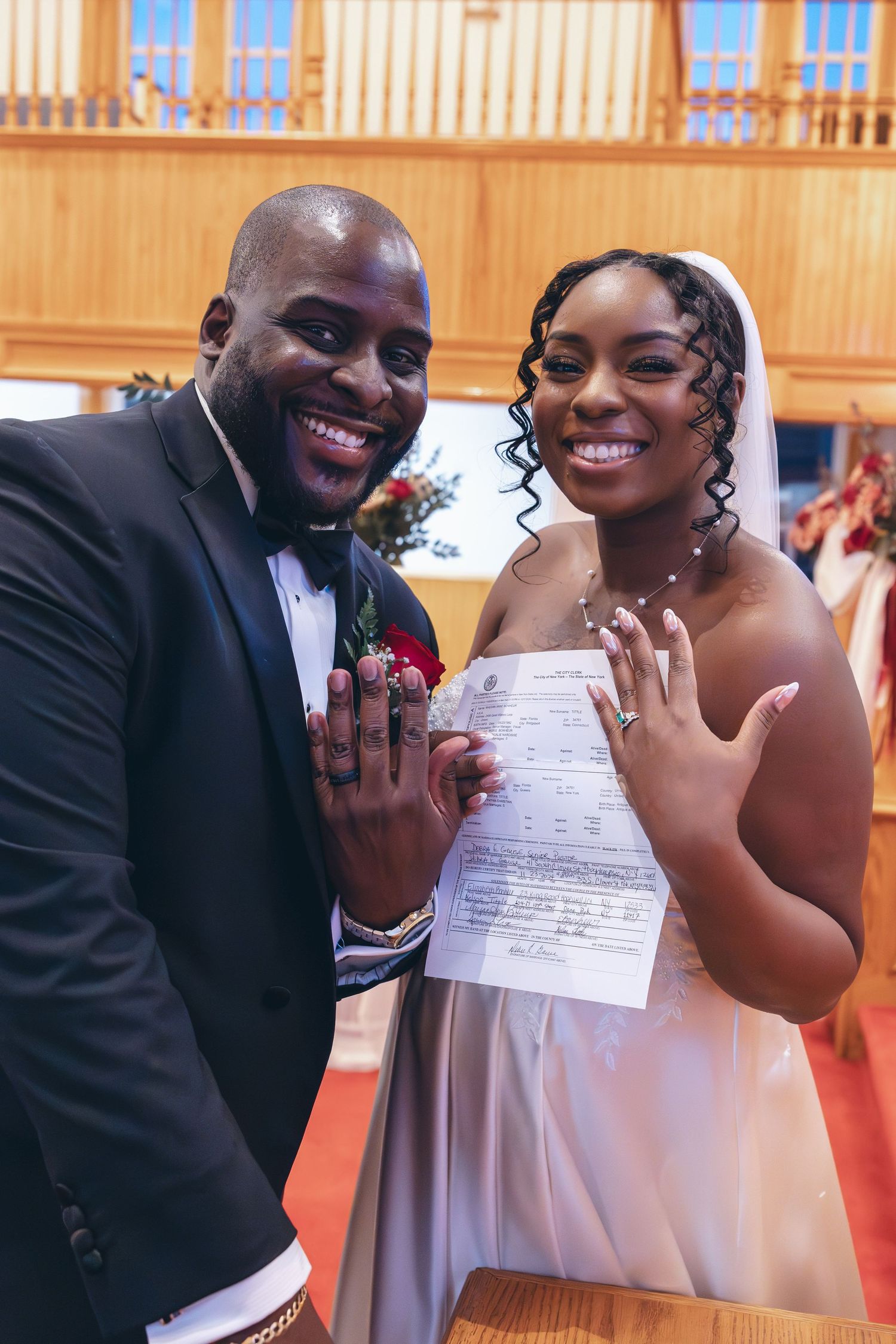 Bride and groom with their wedding certificate