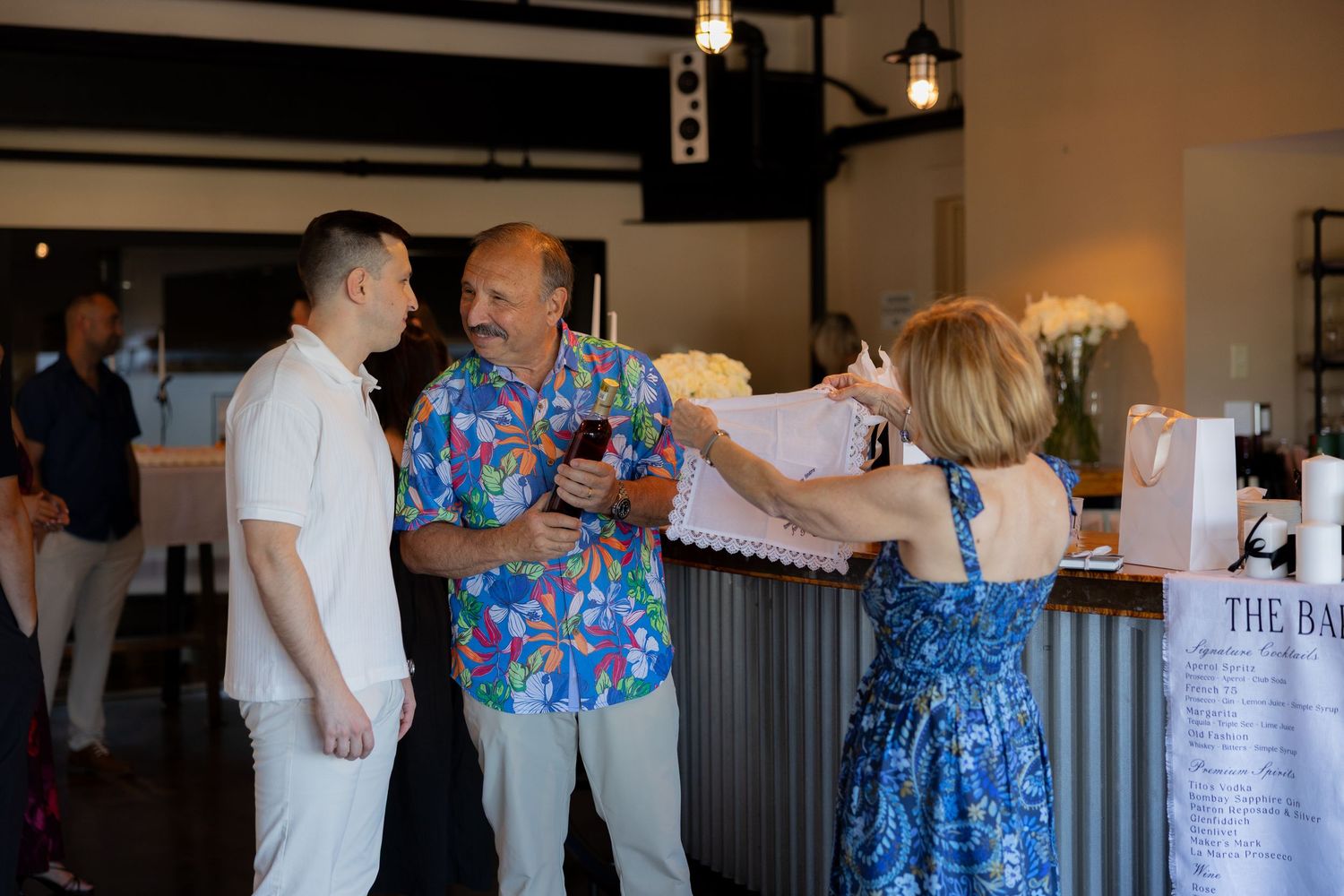 Couples enjoying dancing lessons in a studio space with dark wood paneling and soft lighting.