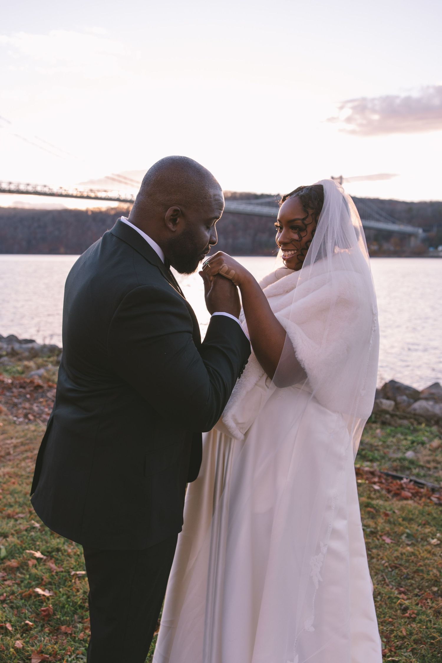 Groom kissing brides hand