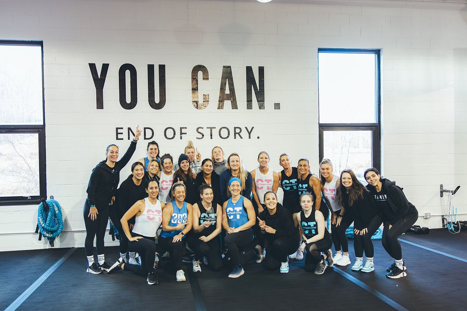 BurnBootCamp Fairfield members posing in front of sign after winning hero games!