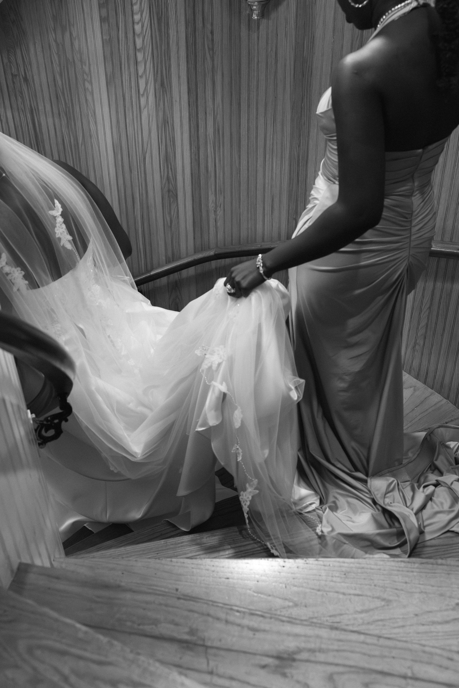 Bride and Maid of Honor walking down the stairs after Hudson Valley wedding ceremony
