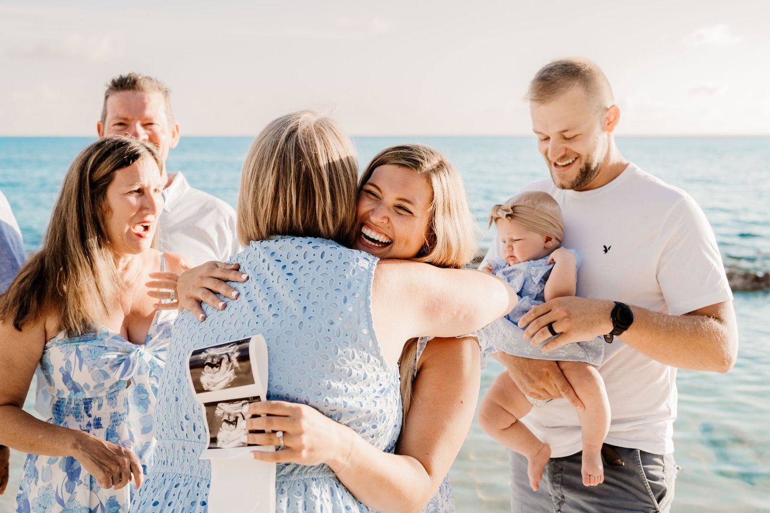 Candid moments of a family sharing joyful interactions on a bright beach setting.