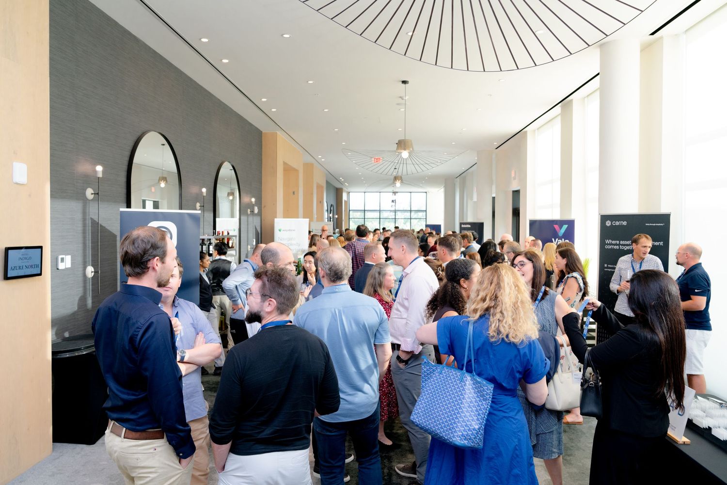 Large group of attendees networking at professional business conference.