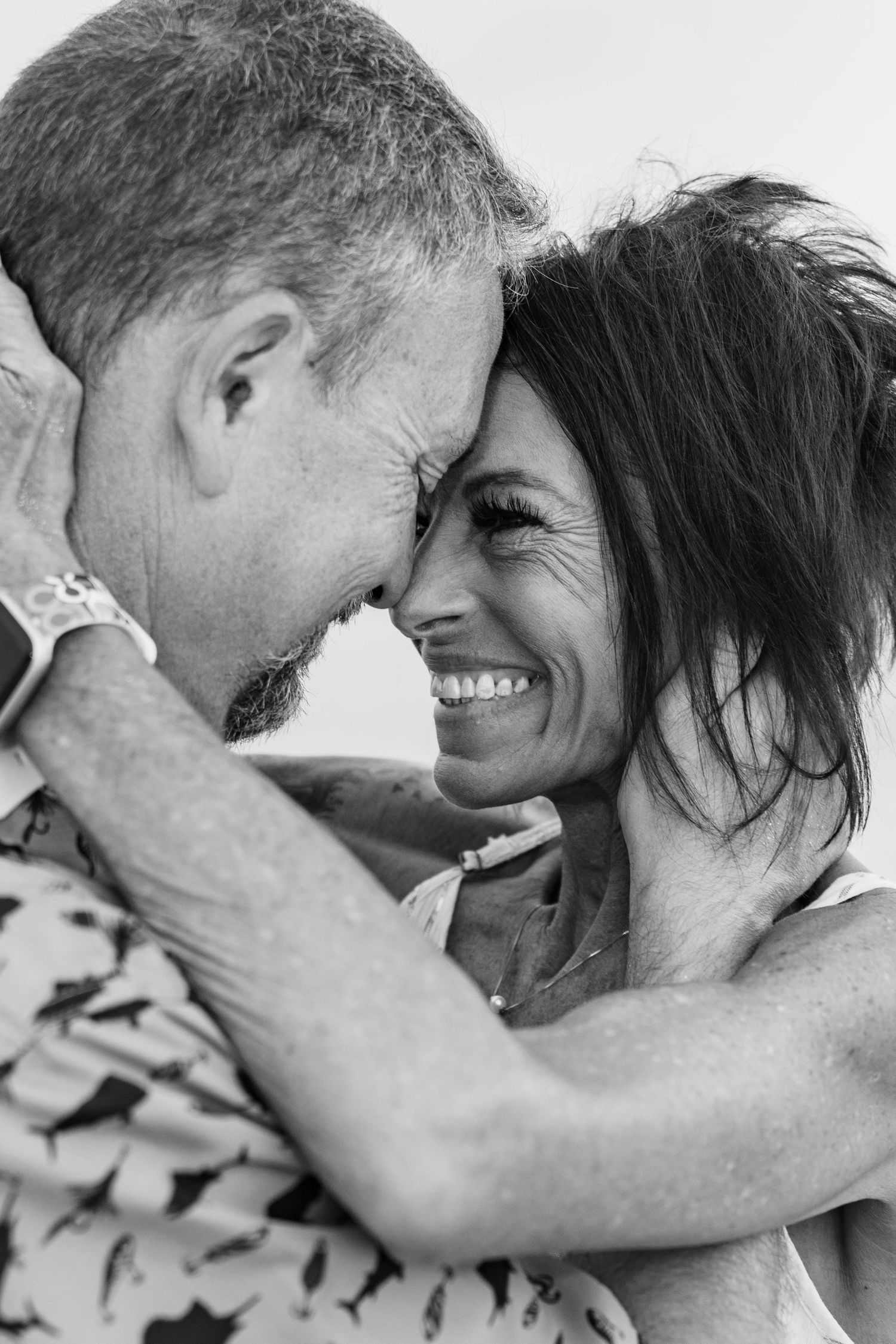 Black and white intimate portrait capturing a tender emotional moment.