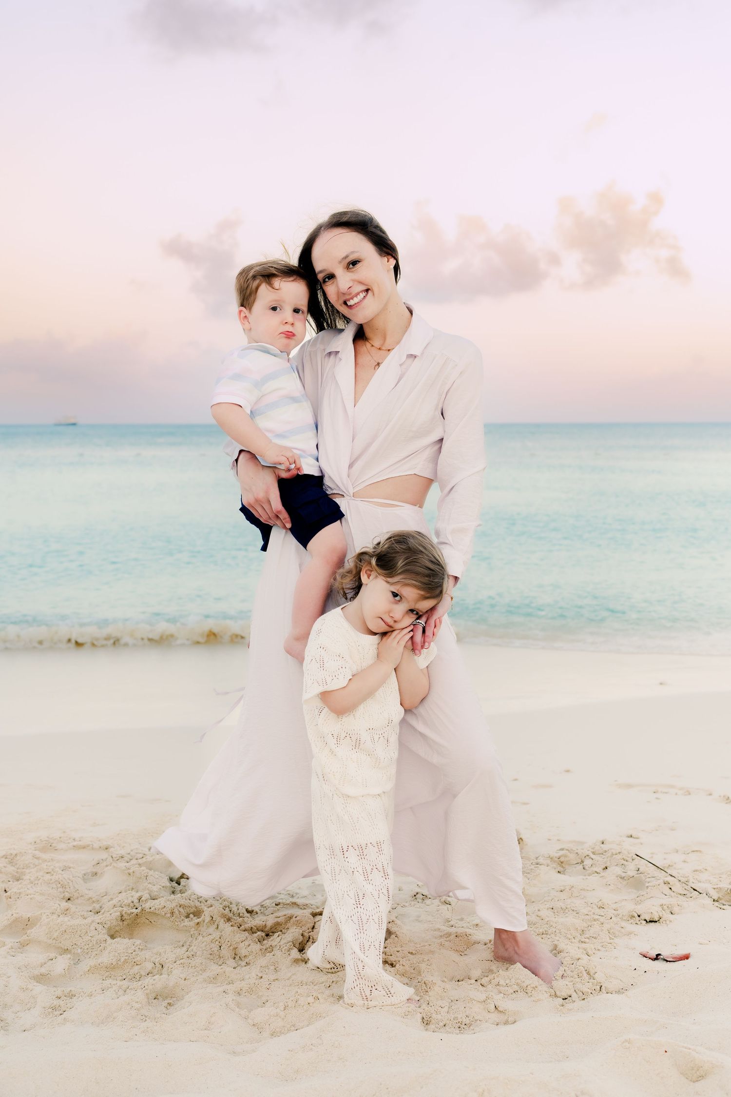 Candid family photos showing joyful interactions on a tropical beach during golden hour.