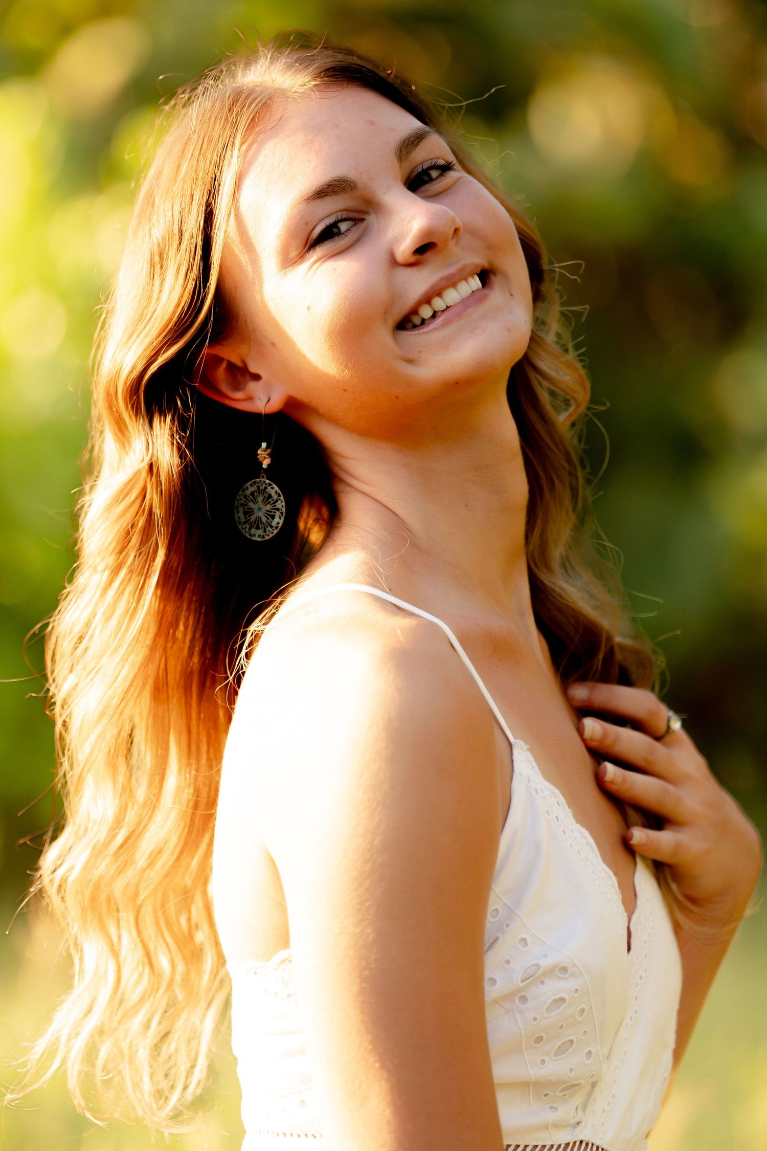 Series of dreamy outdoor portraits with golden sunlight and natural expressions.
