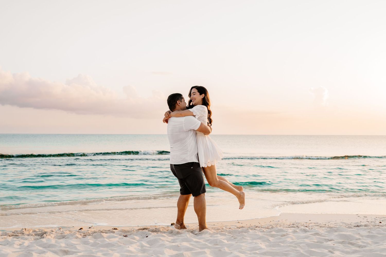 Beach proposal photography sequence with ocean backdrop at sunset.