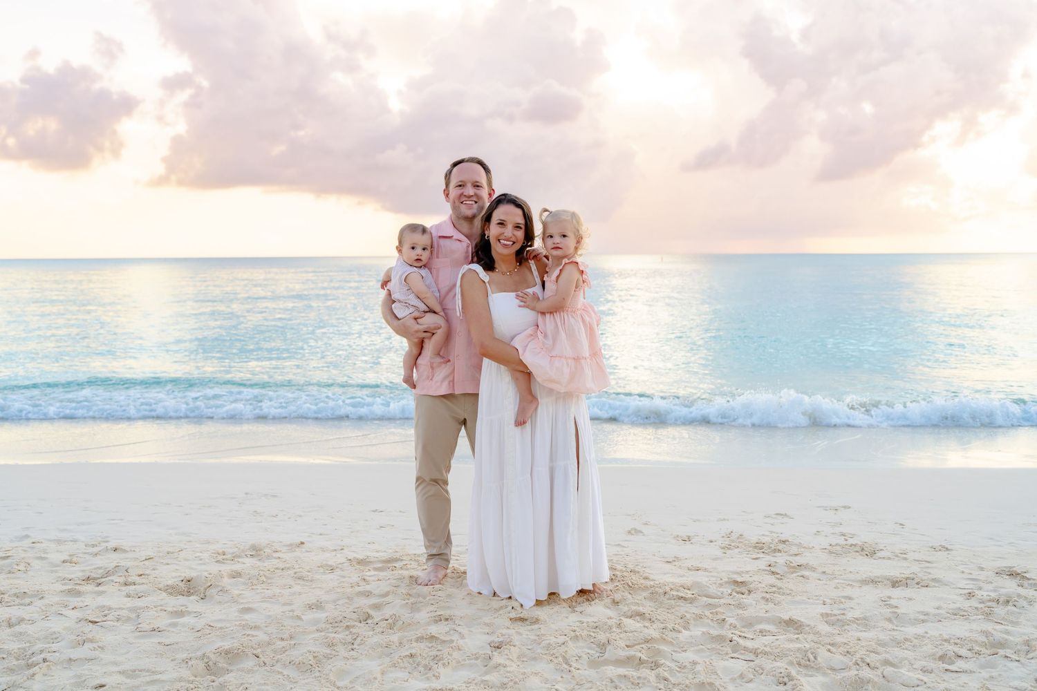 Family portrait session on a beautiful beach at sunset.