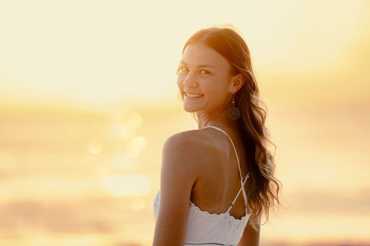 Sun-drenched beach portraits with warm golden hour lighting.