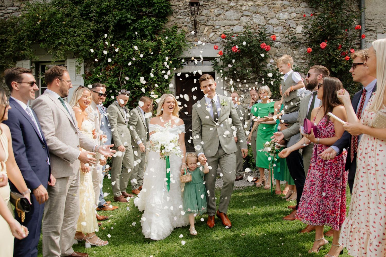 Documentary style Wedding Photographer captures confetti photos at Morzine Wedding venue. Natural, timeless and candid wedding photography.