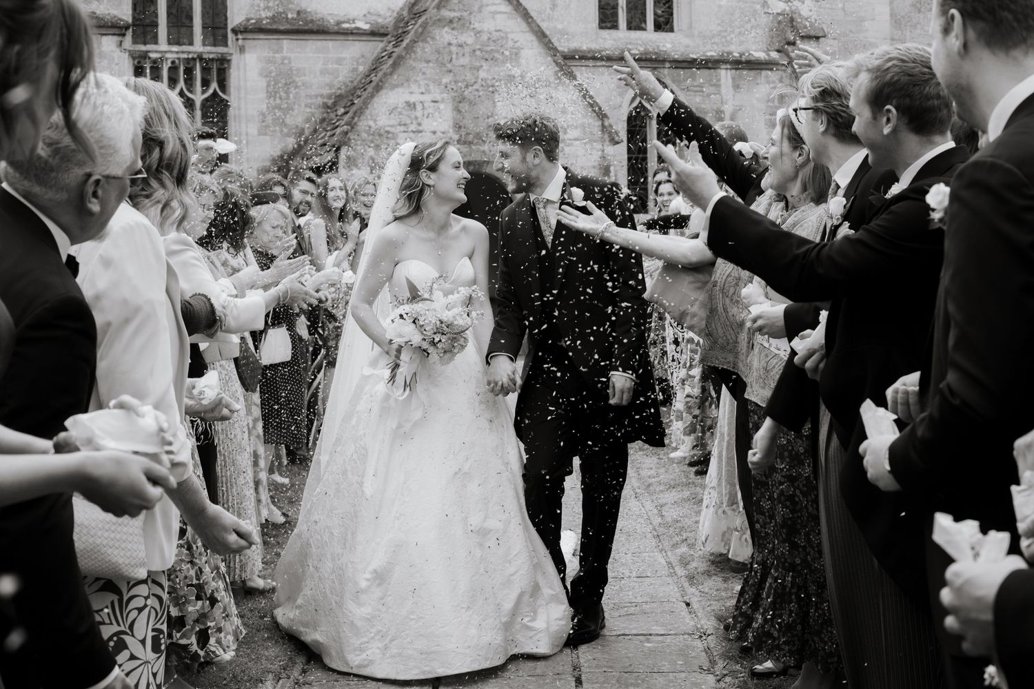 Candid Cotswold Wedding Photographer captures confetti at Gloucestershire Wedding Venue. Natural, candid and timeless photography, UK
