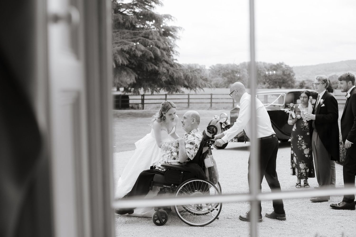 Documentary Style Cotswold Wedding Photographer captures wedding party at a Gloucestershire Wedding Venue. natural and candid wedding photos