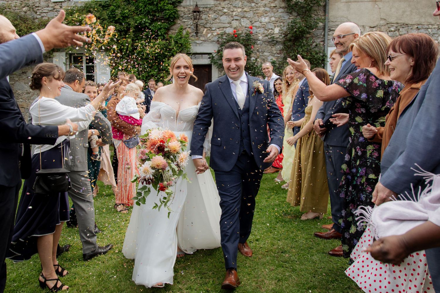 Morzine Wedding photographer captures epic confettie and real emotions in Morzine Wedding Venue. Candid,timeless documentary style photos