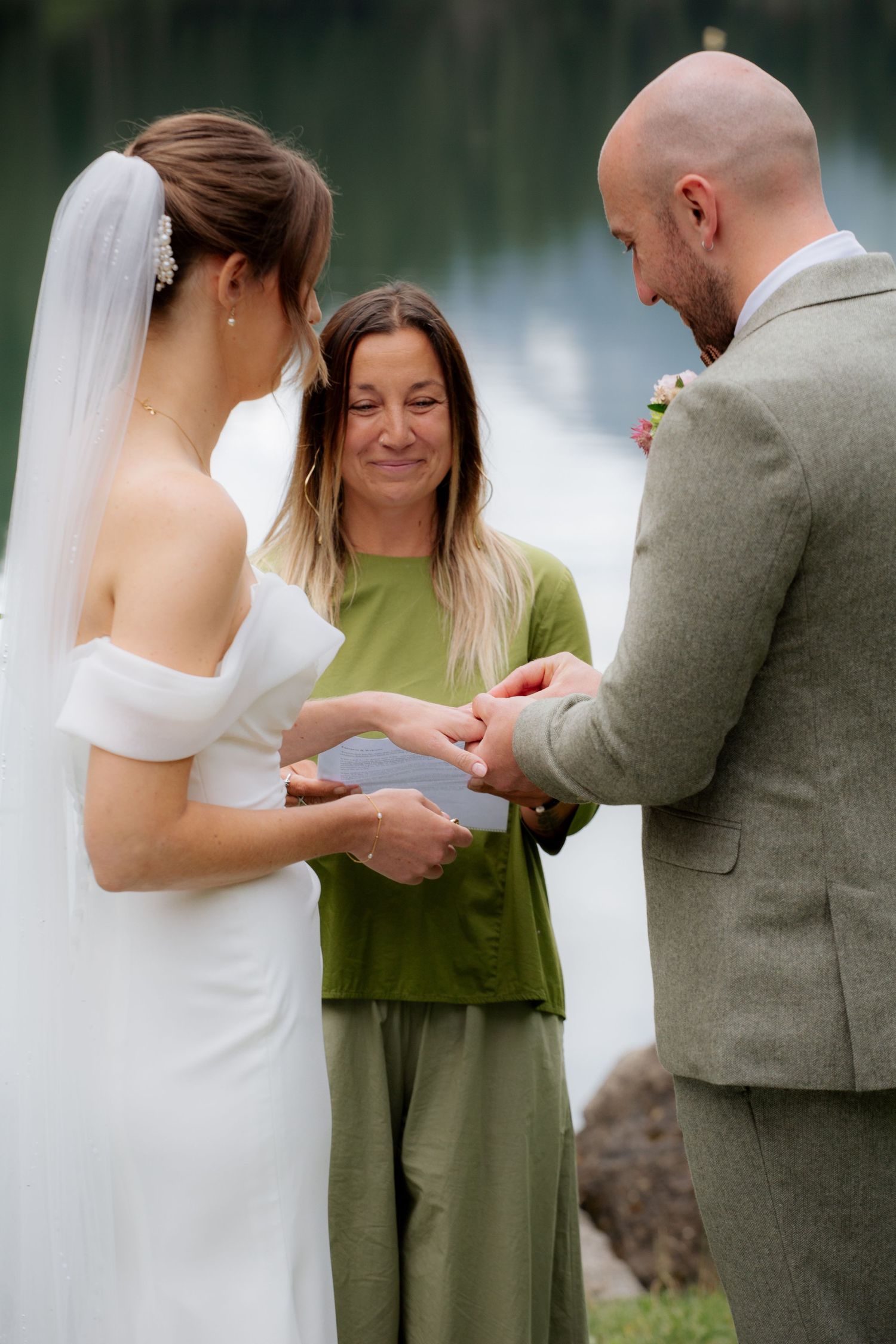 Morzine Wedding photographer captures outdoor wedding cermeony photo on Lac Montriond. Candid timeless documentary style photography.