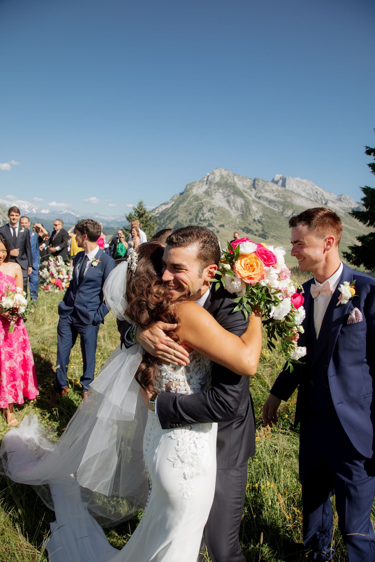 Morzine Wedding Photographer captures wedding ceremony photo at La Clusaz Wedding venue. French Mountain Wedding photographer. Outdoor Bride